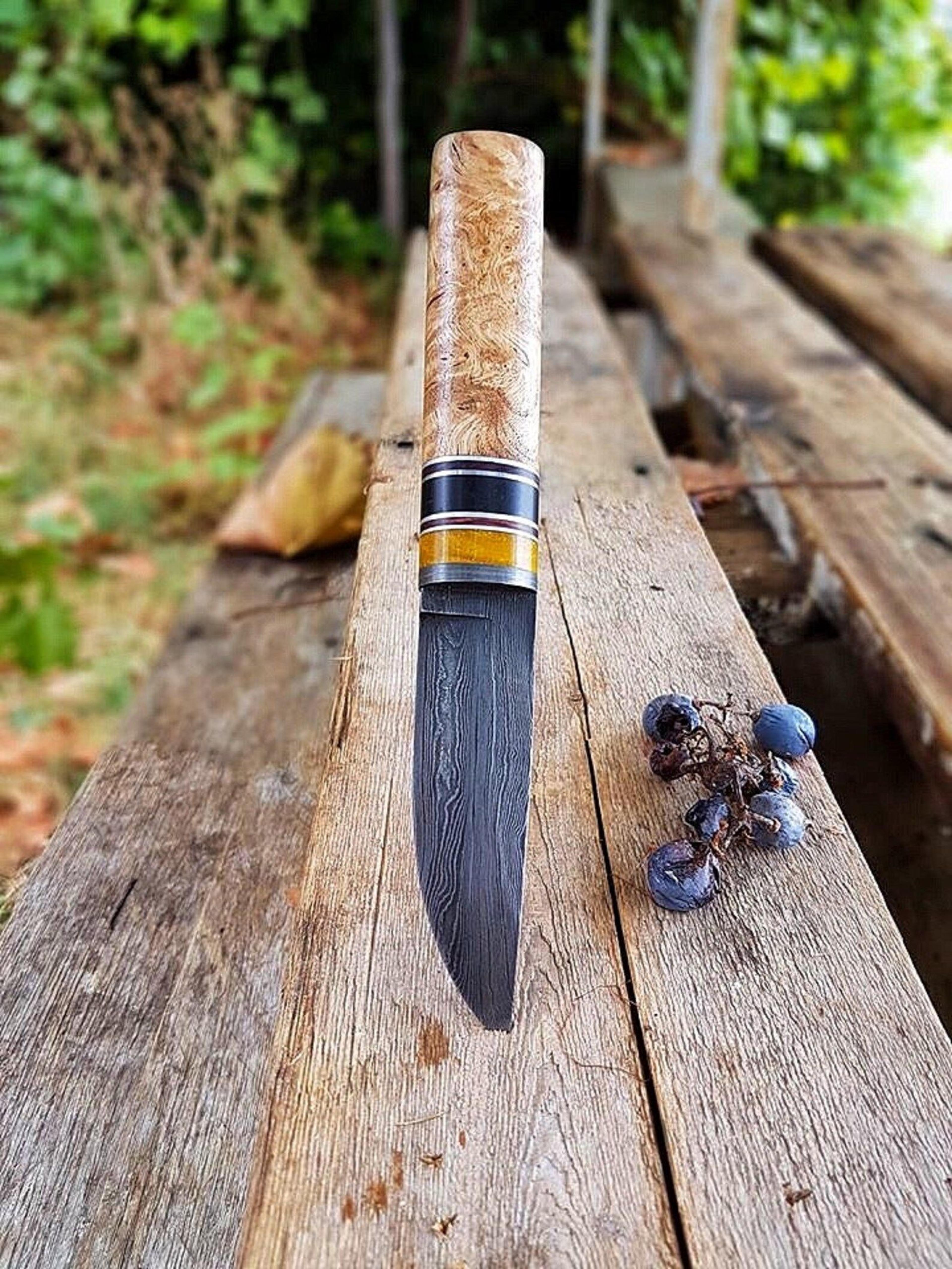 premium blacksmith forged puukko knife in damascus steel with natural wood handle