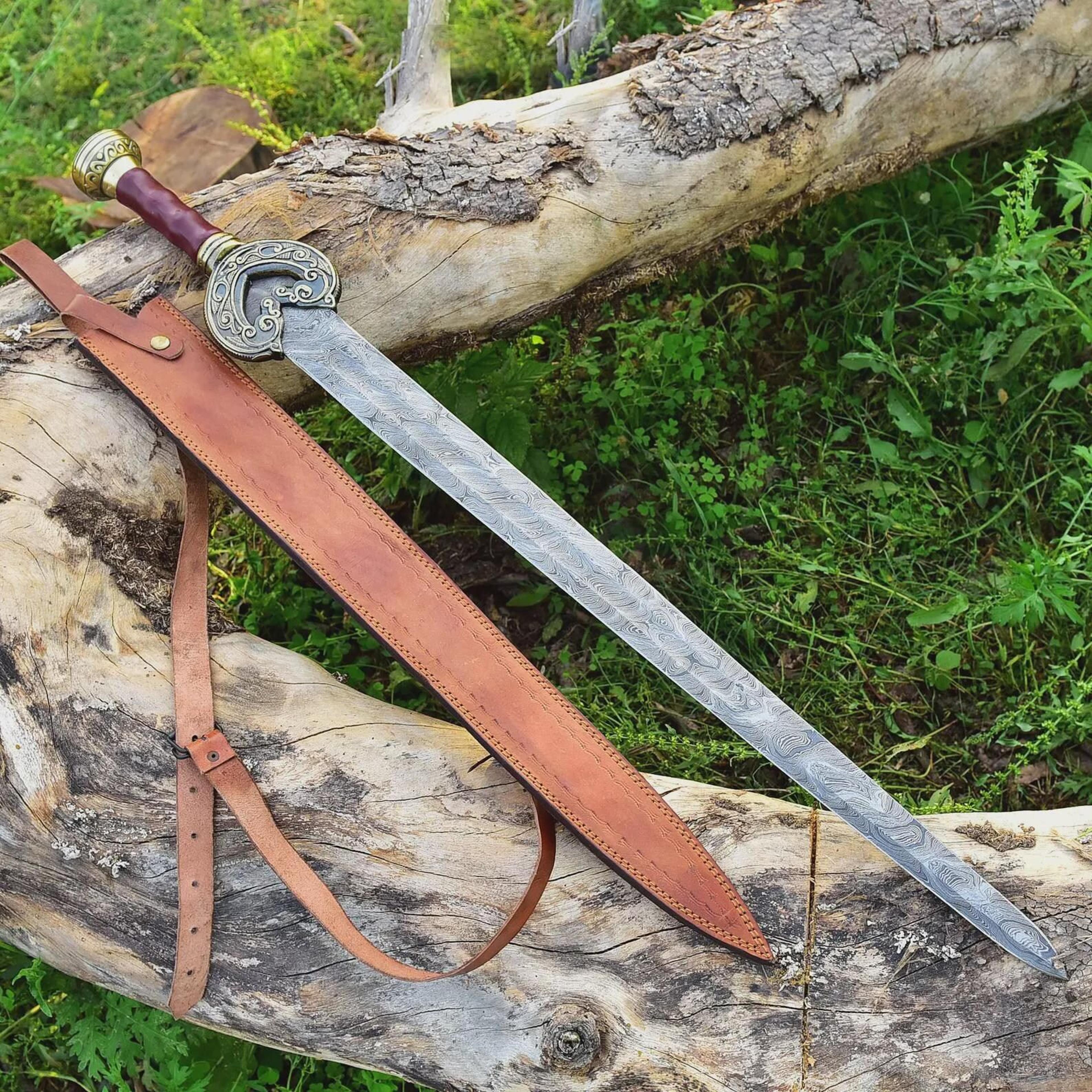 unique handcrafted damascus steel sword with leather wrapped handle and high quality italian leather sheath