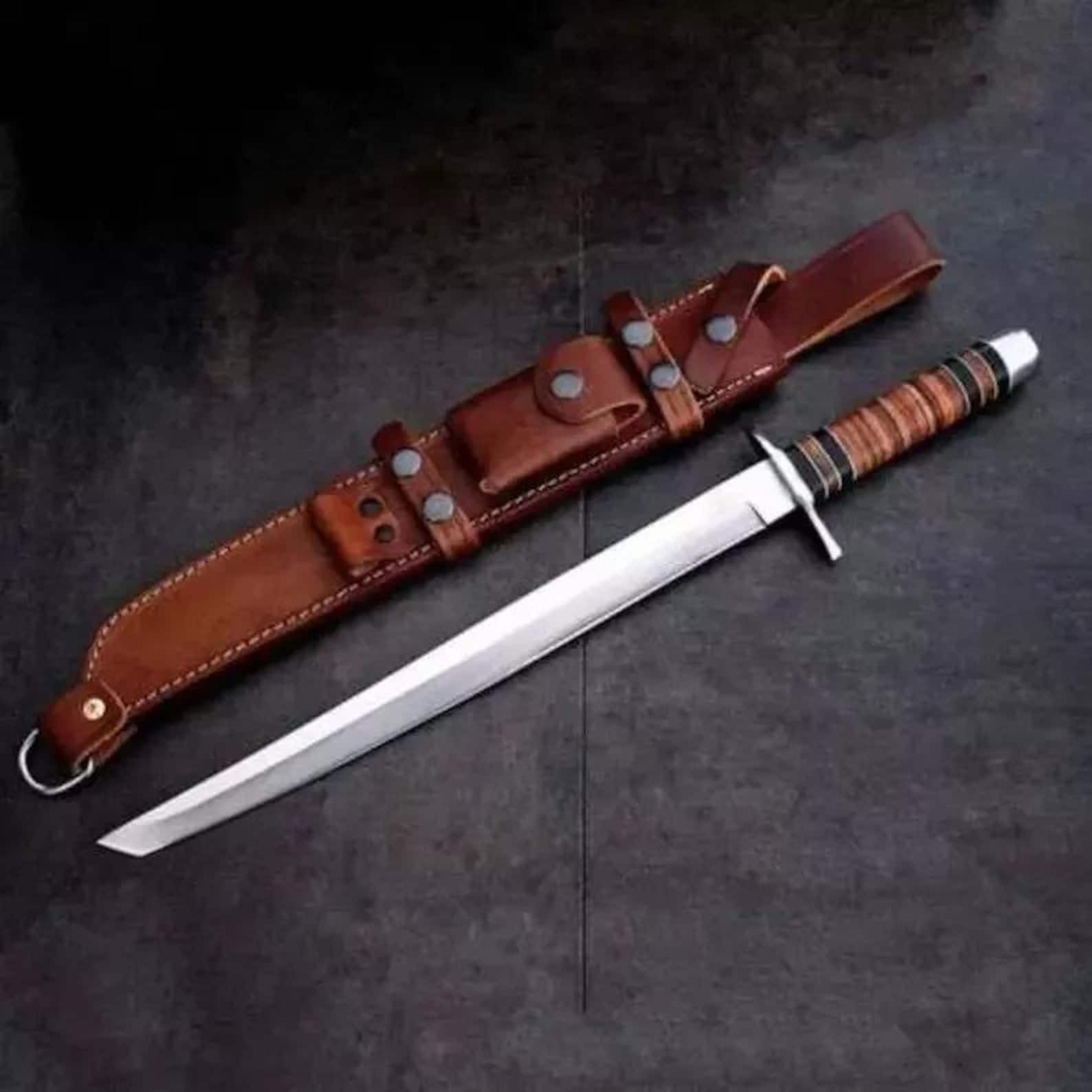 hand-forged carbon steel celtic machete set with intricate knotwork etching and walnut handle