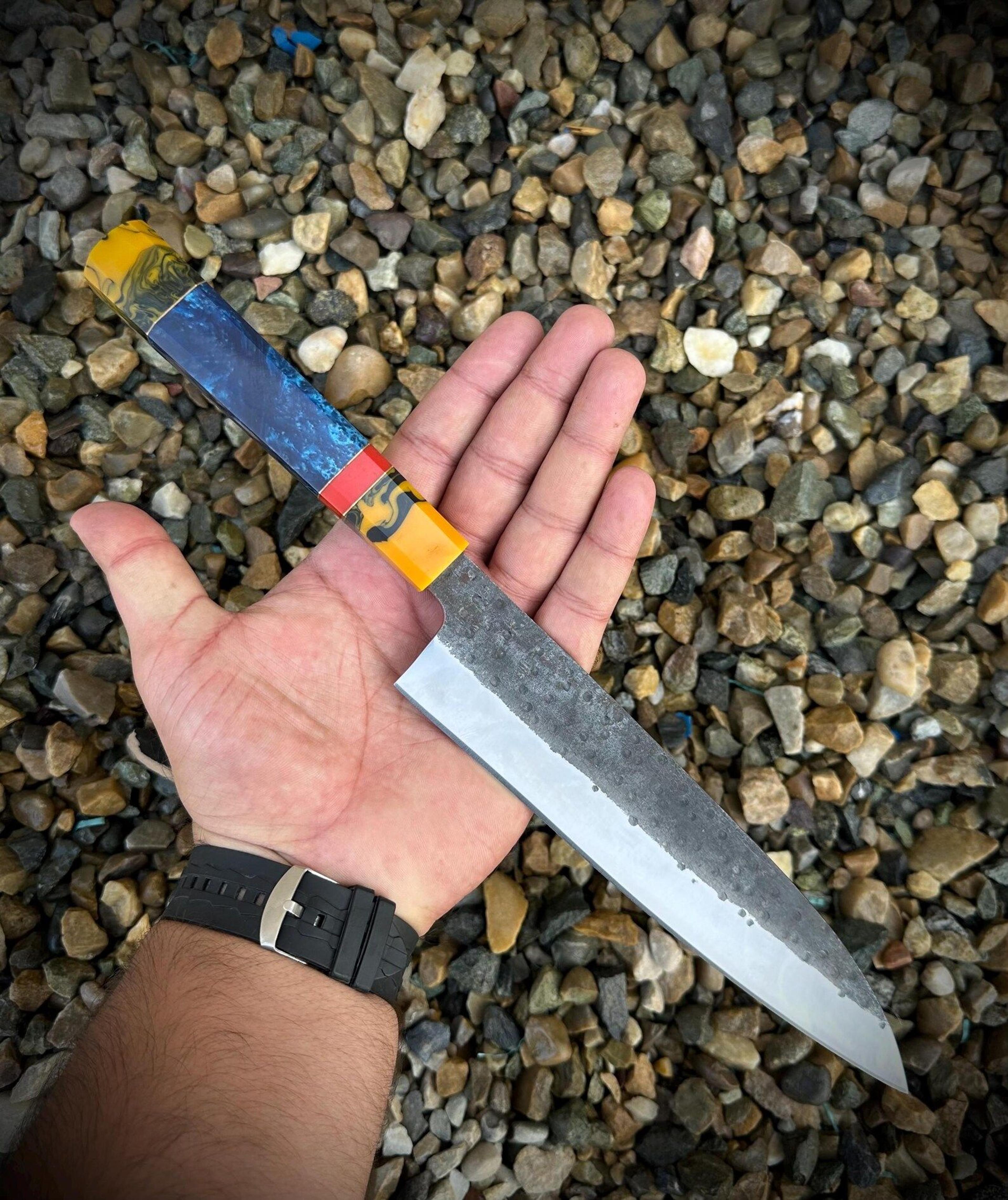 handcrafted artisan chef knife with carbon steel blade and colorful resin handle for kitchen professionals and collector