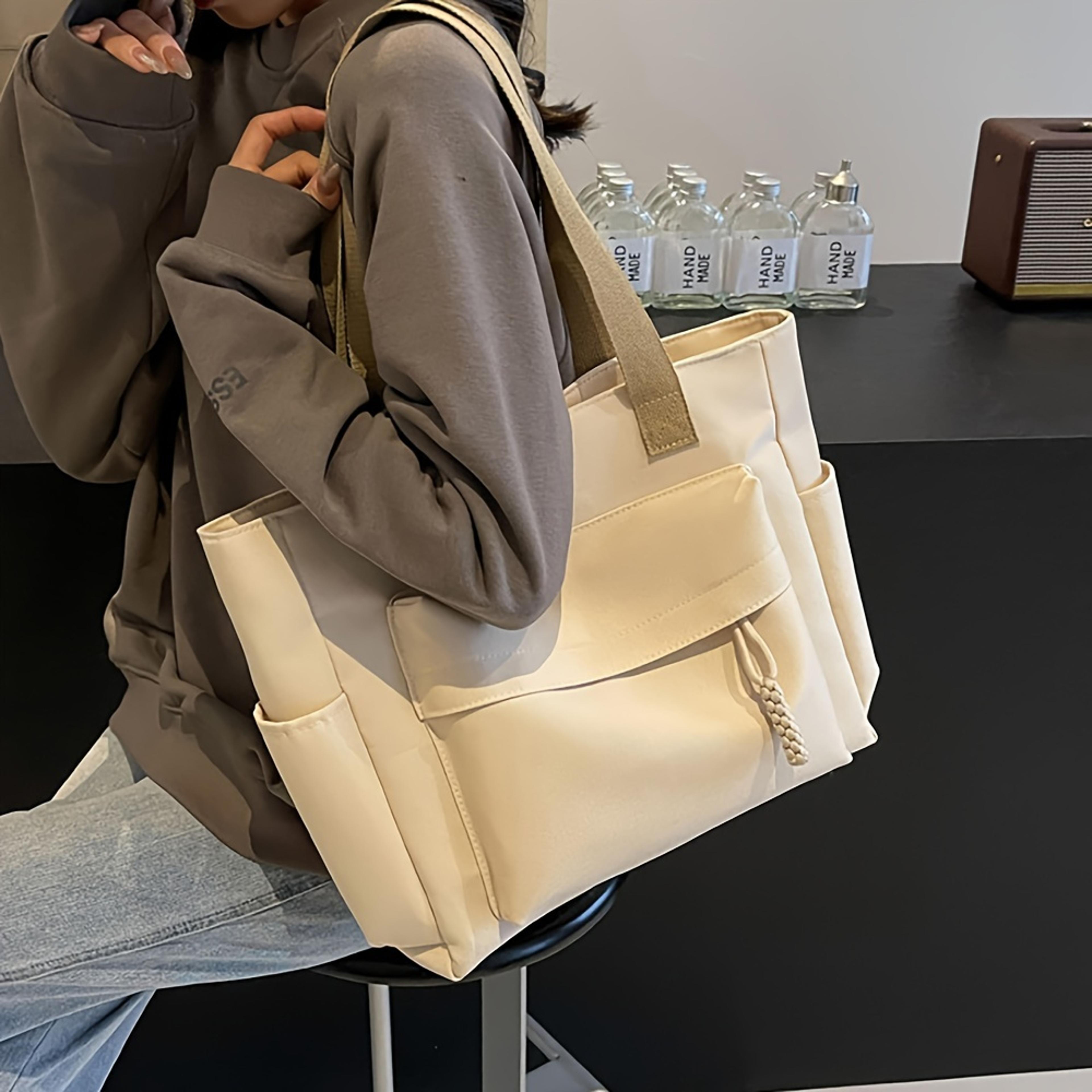 lightweight foldable shoulder bag with multiple pockets for office commute fitness and shopping