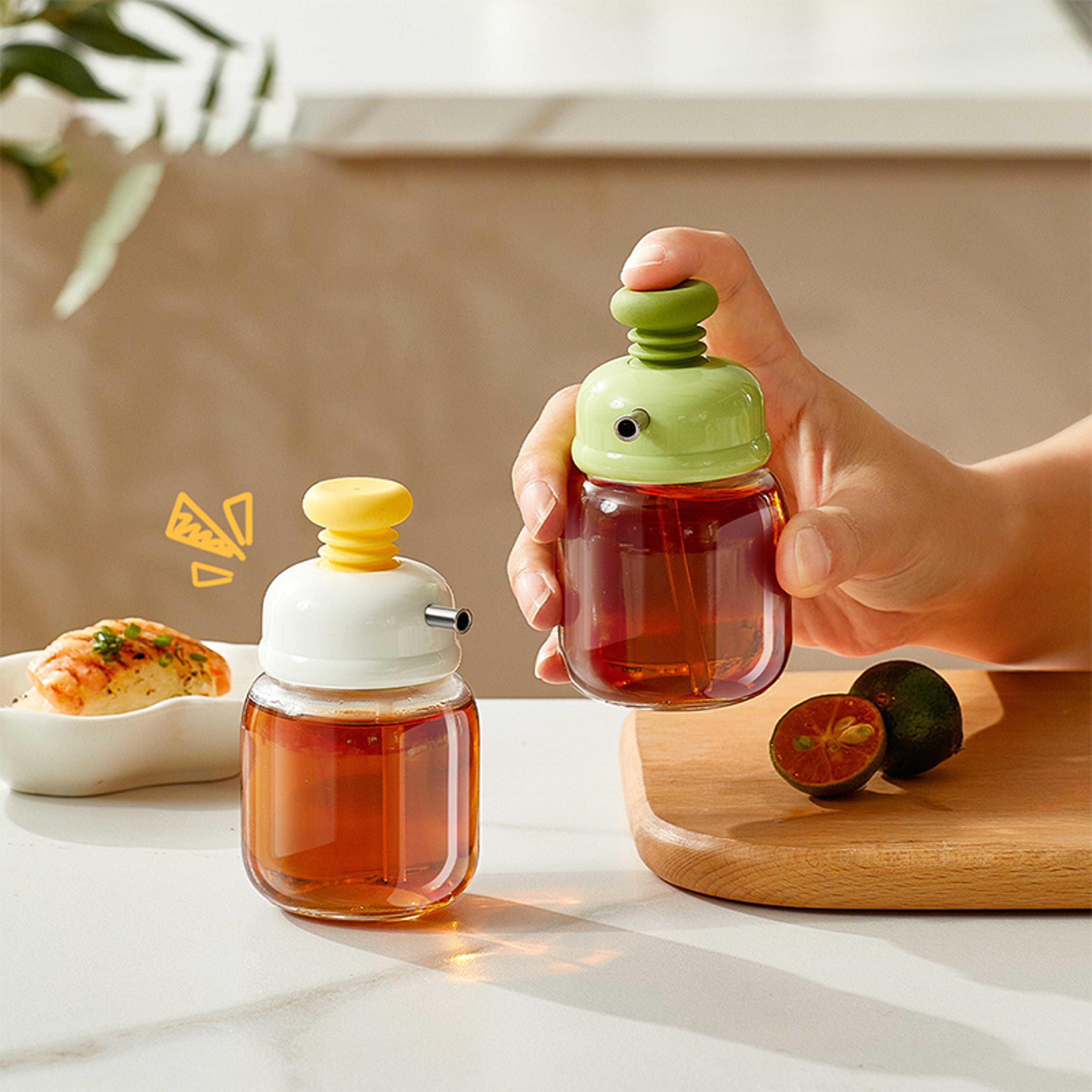 glass oil dispenser bottle with press type metered pour control