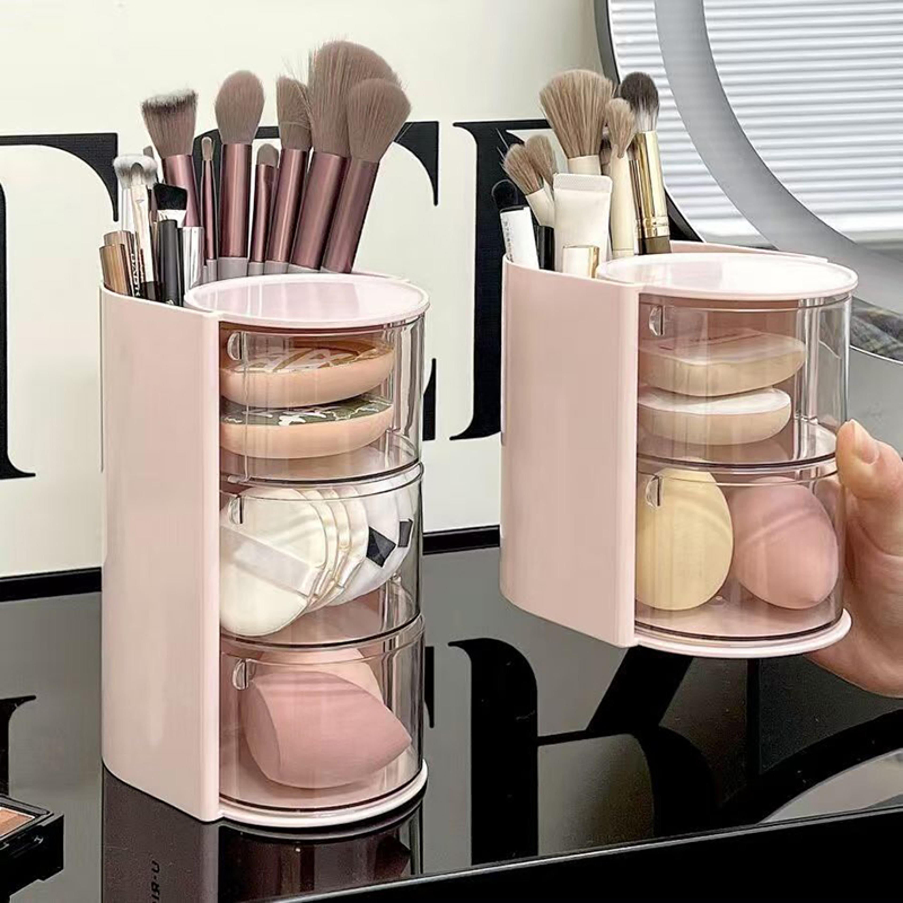 rotating makeup organizer with beauty blender and cosmetic storage compartments