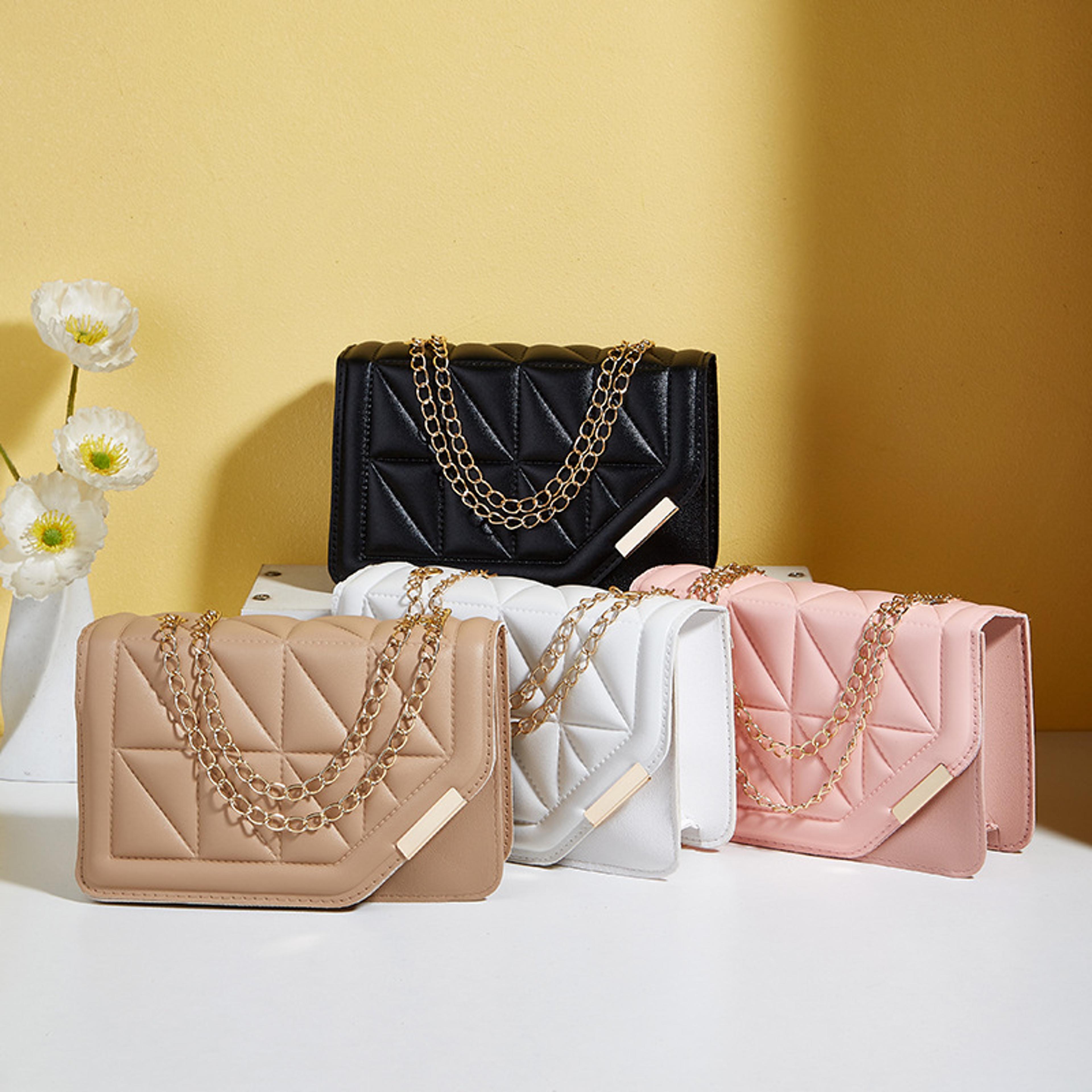 elegant black quilted crossbody bag with chain strap for women