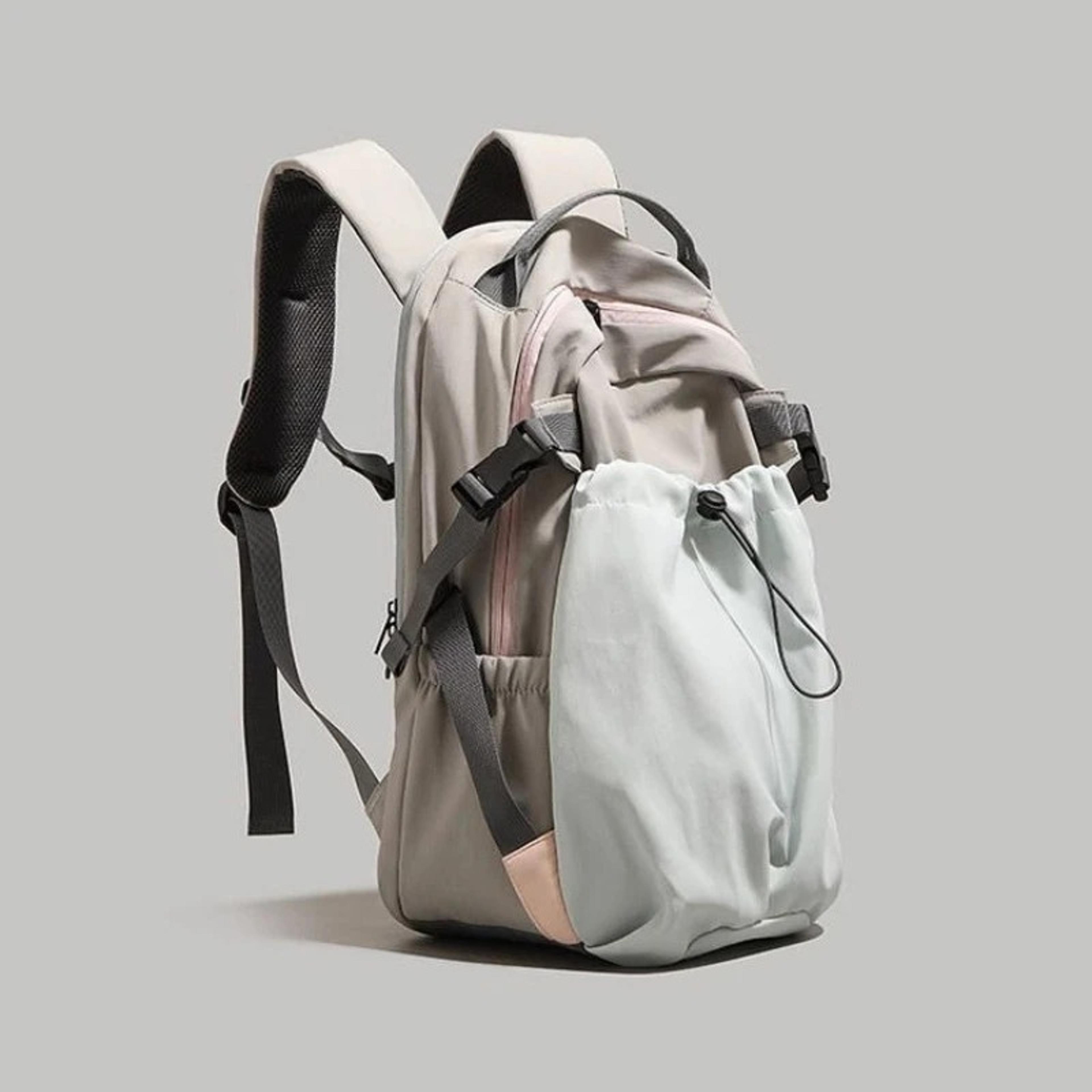 large capacity nylon backpack with padded straps and drawstring side pocket