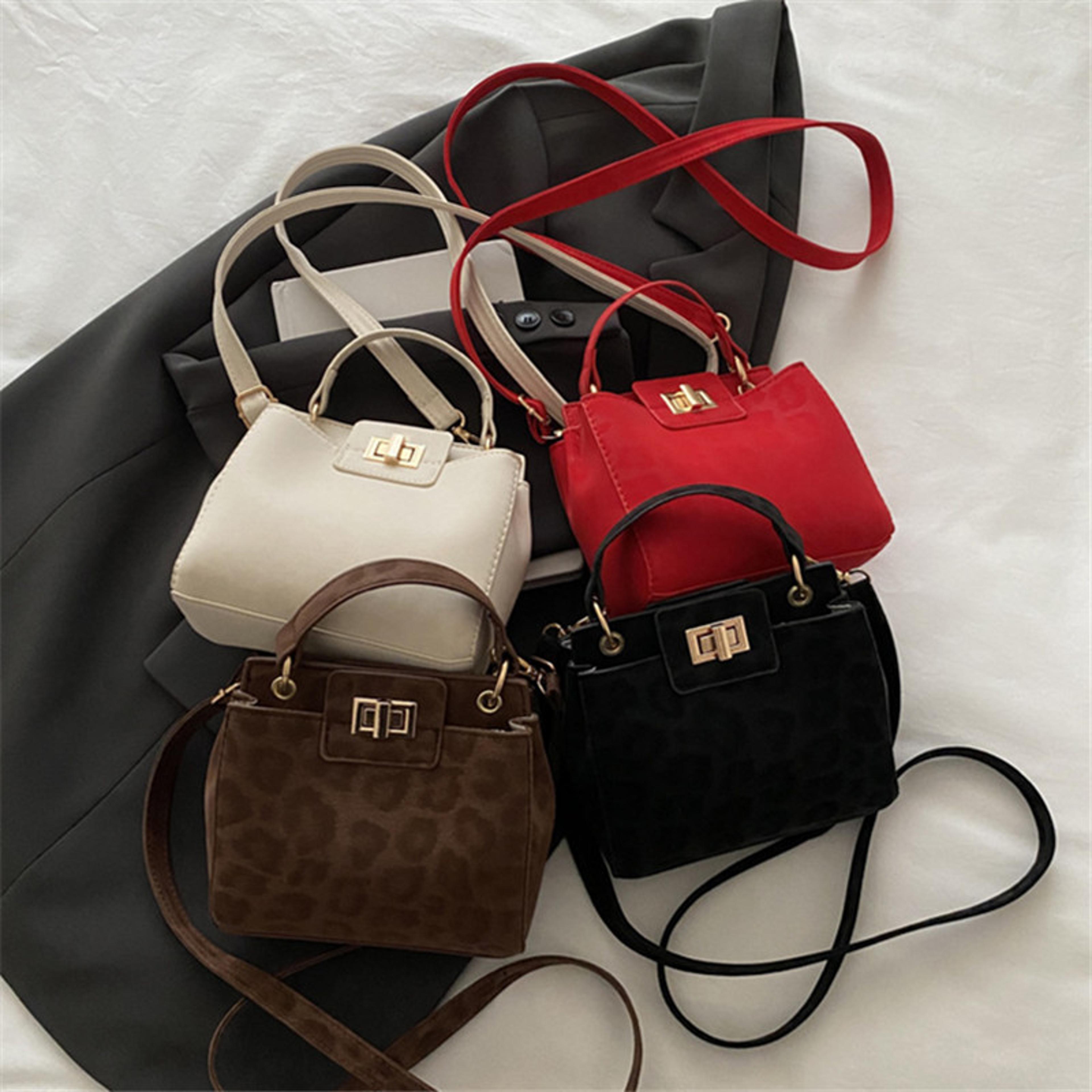 elegant mini top handle crossbody bag for women with gold lock