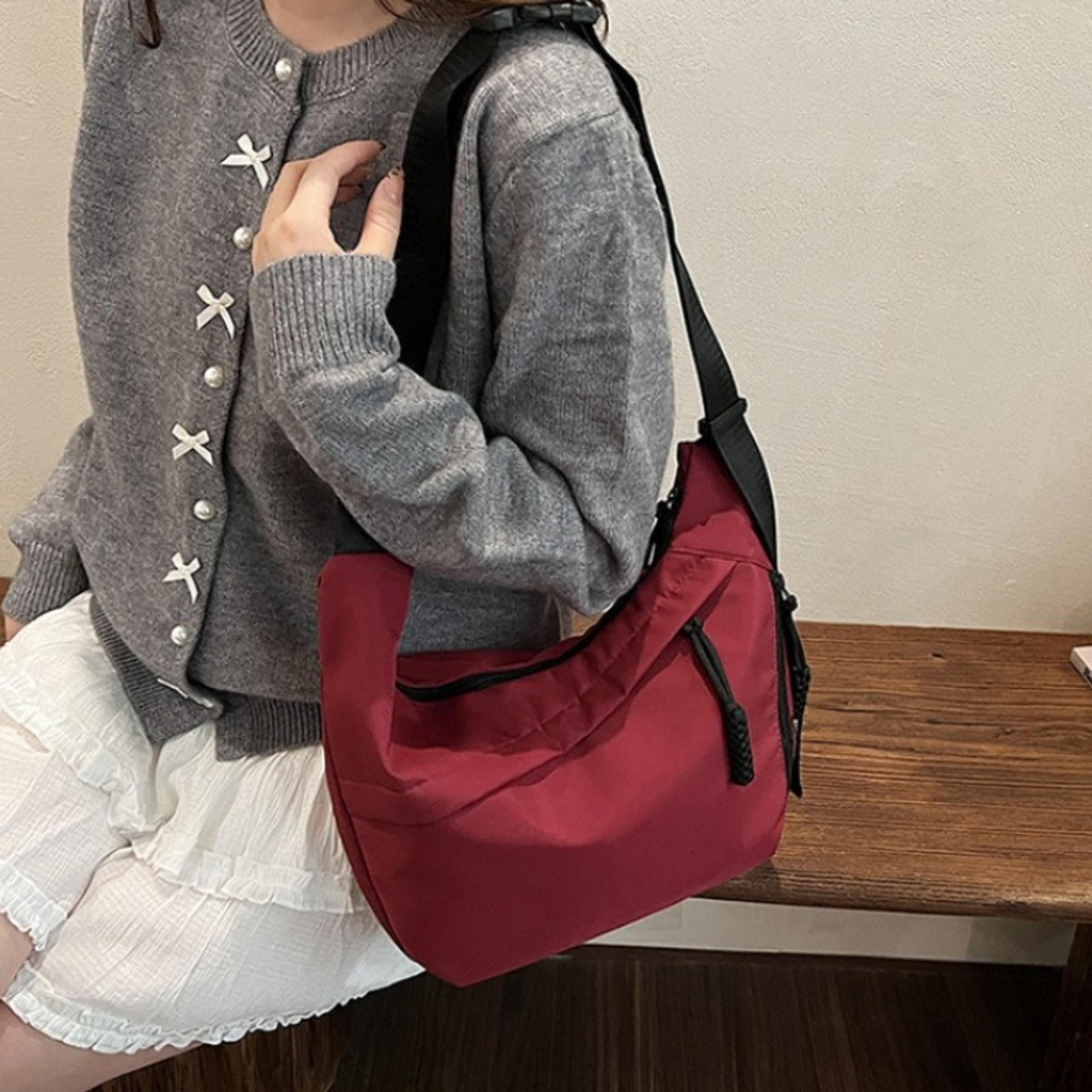 womens nylon crescent crossbody bag with adjustable wide strap for travel and everyday wear