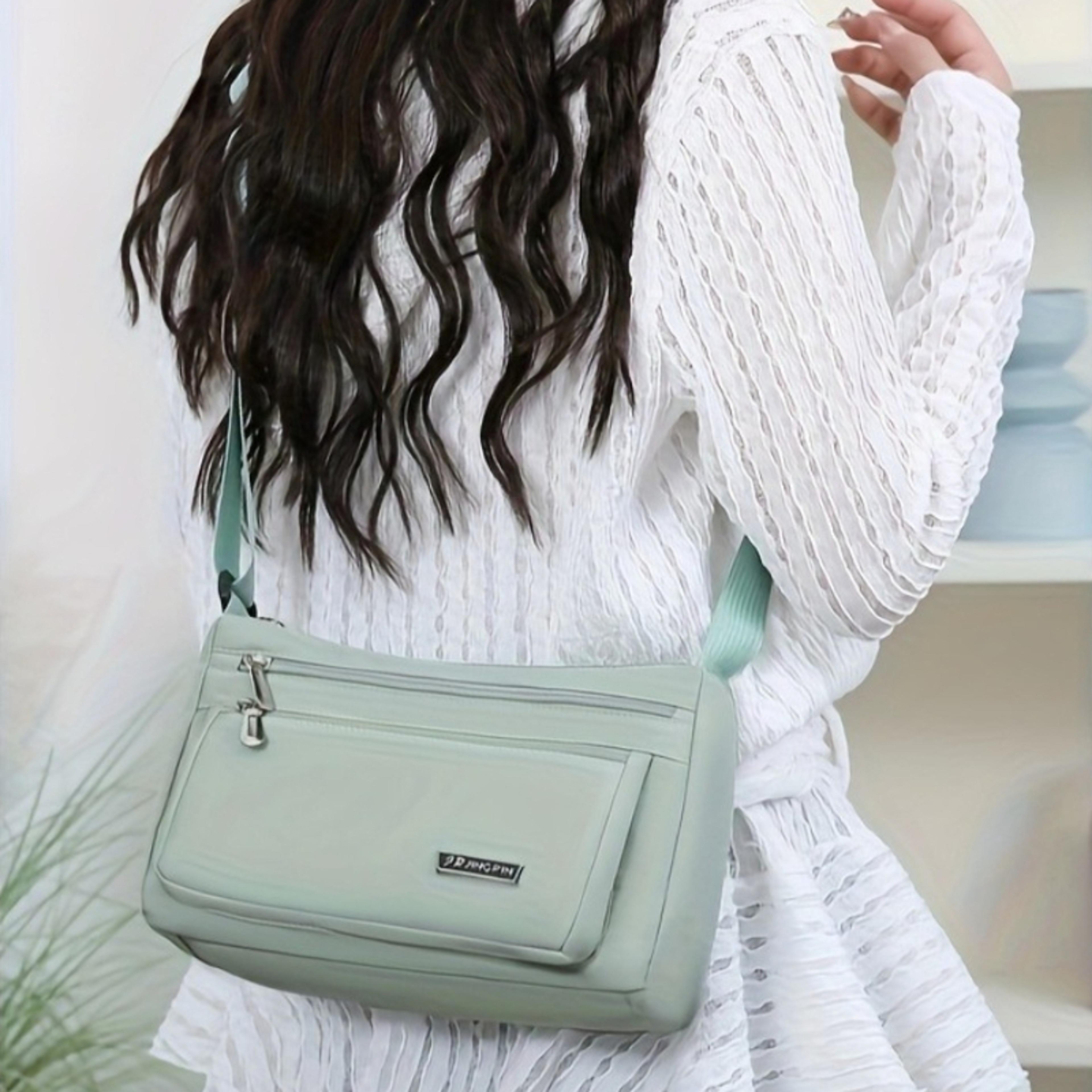 lightweight multi pocket crossbody sling bag for travel and commuting