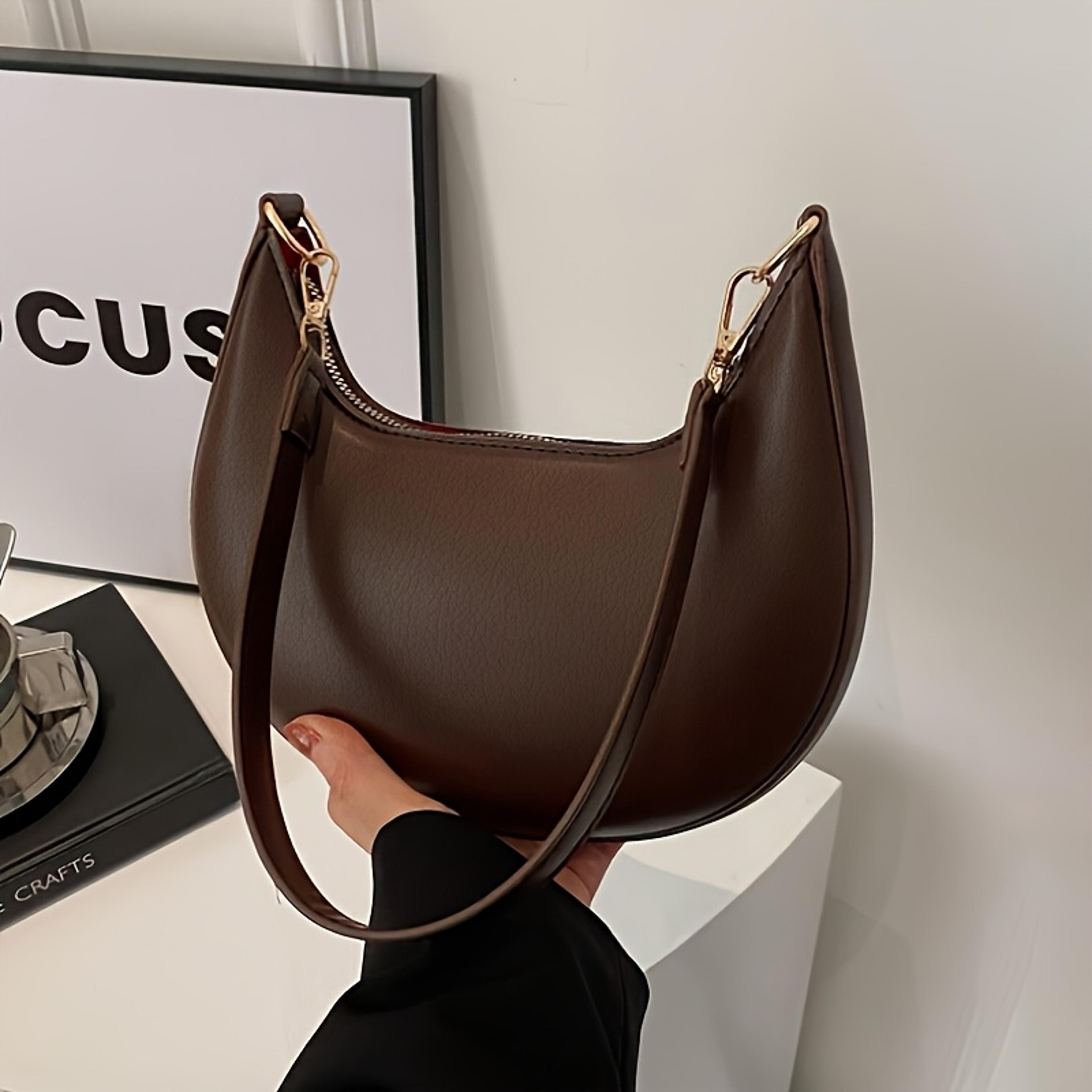 luxury crescent shoulder bag for women with adjustable strap and zip closure