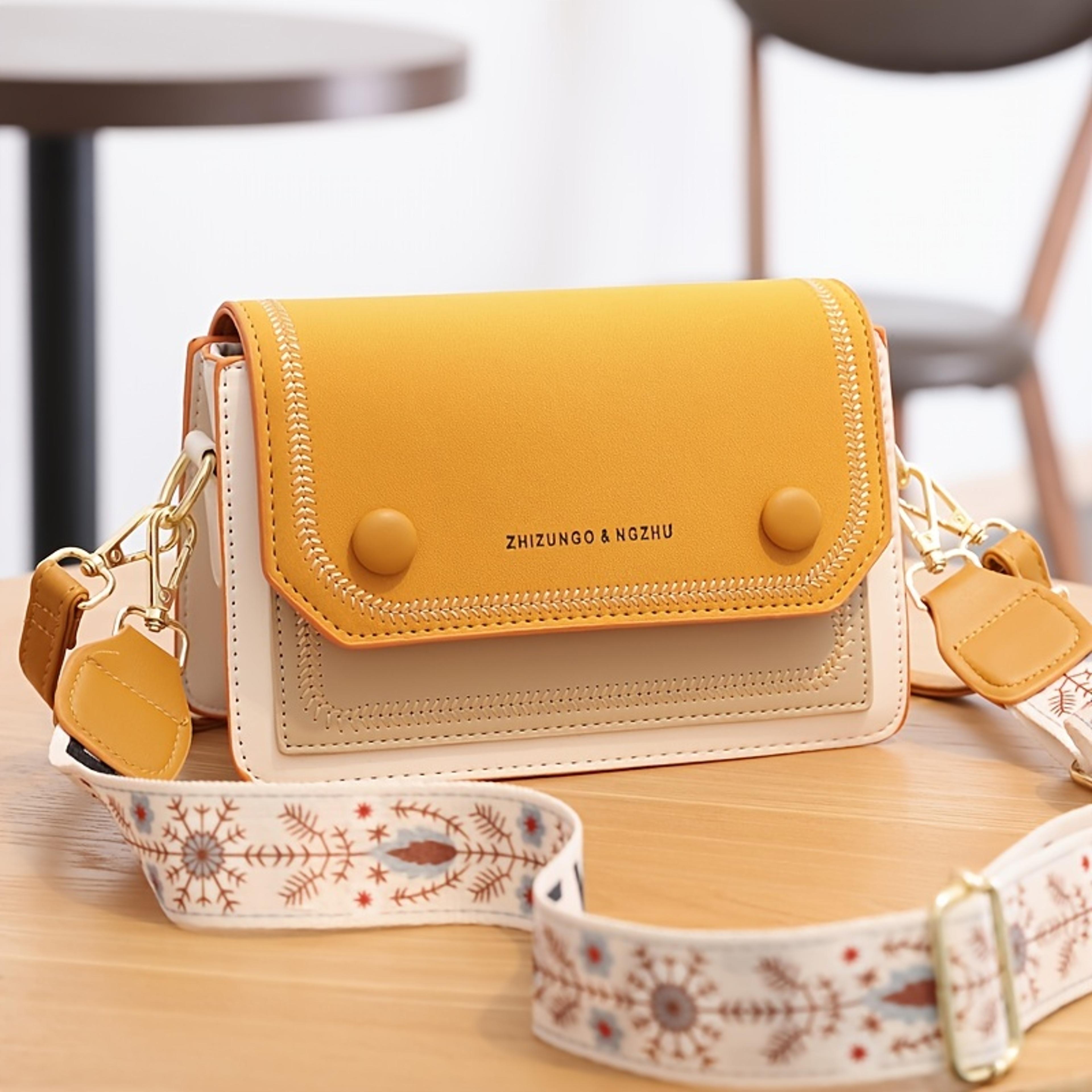 black white embroidered crossbody bag with wide adjustable strap