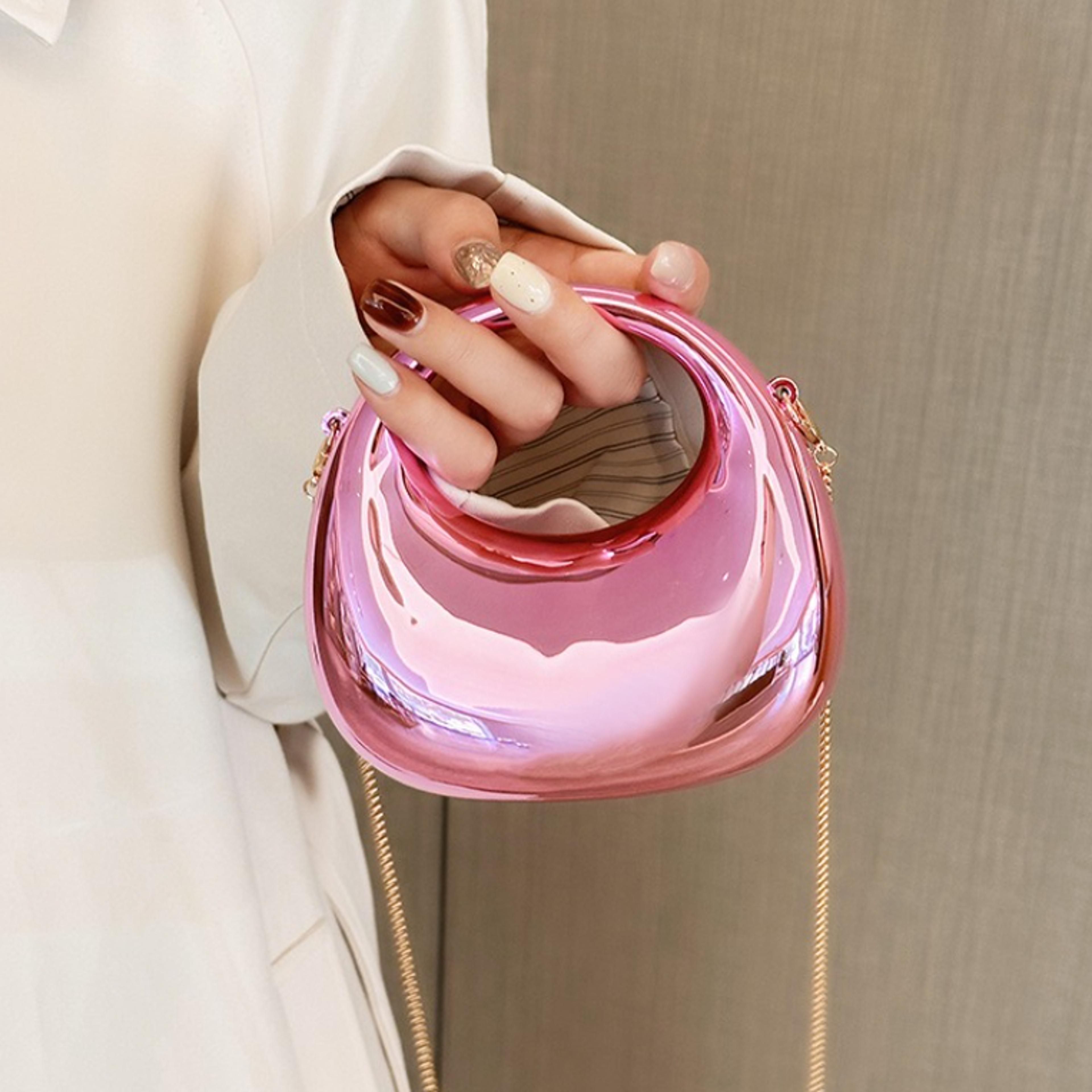 glossy mini evening bag with circular top handle and chain strap