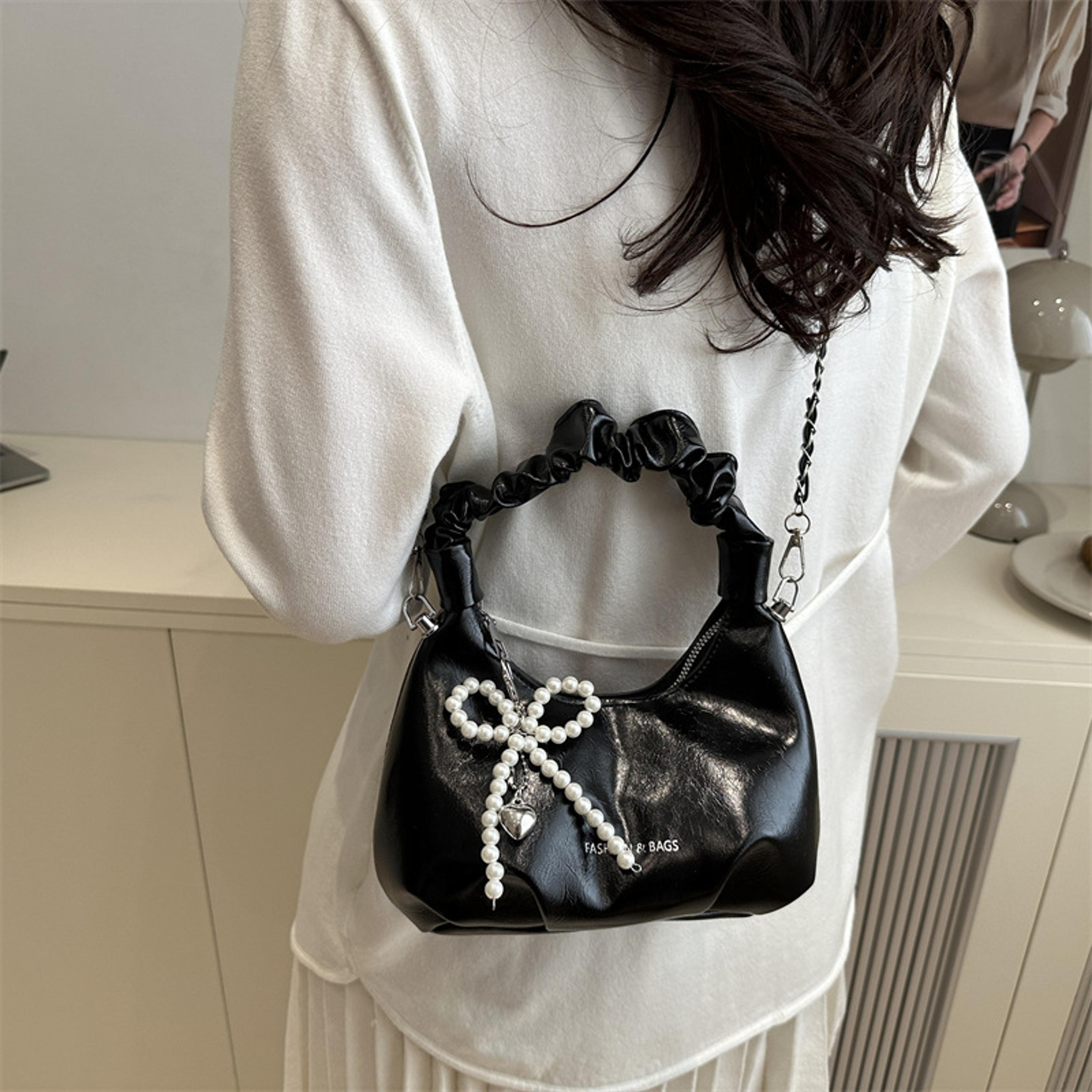 shiny crescent ruched shoulder bag with pearl bow charm