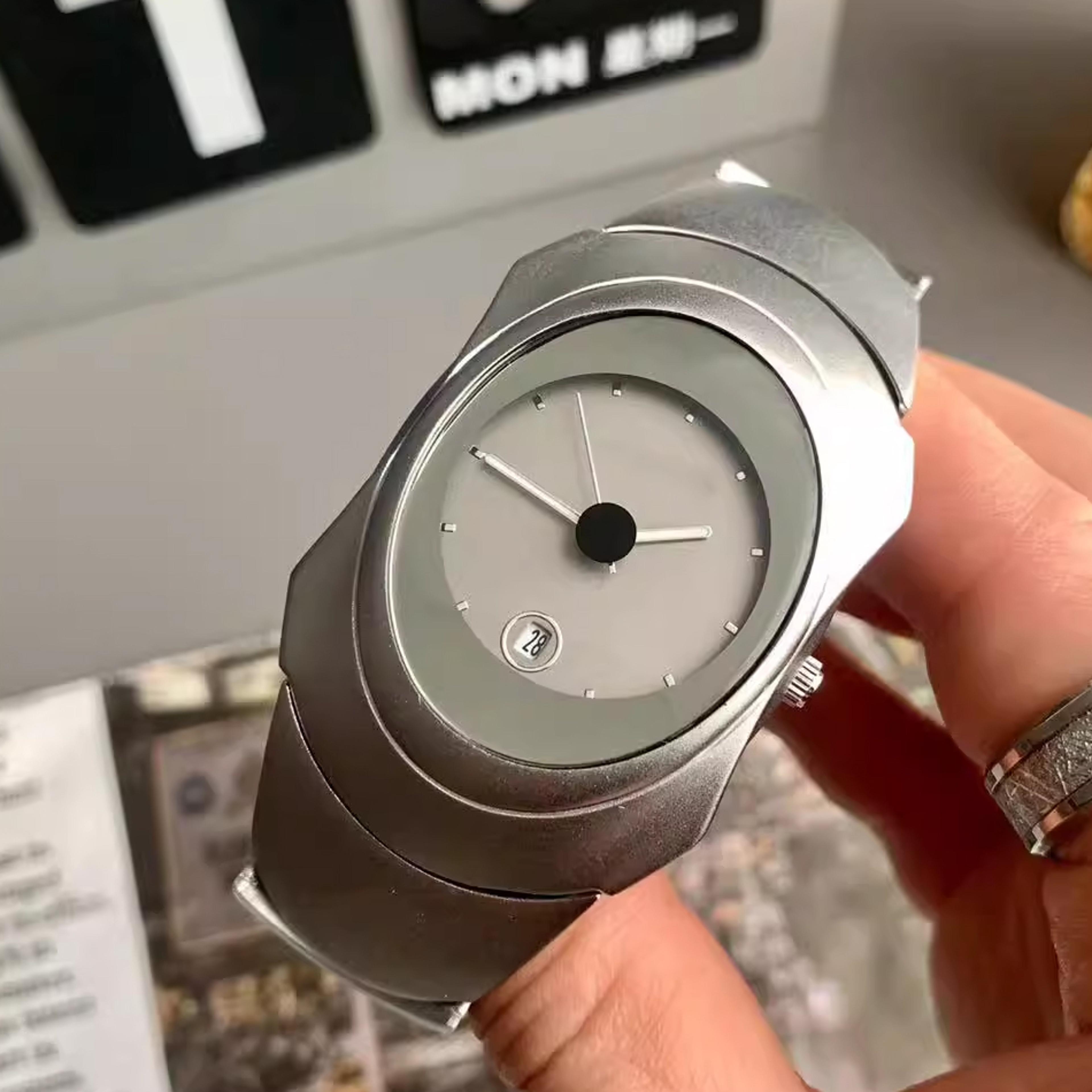 minimalist futuristic mens quartz watch with irregular oval dial and date display
