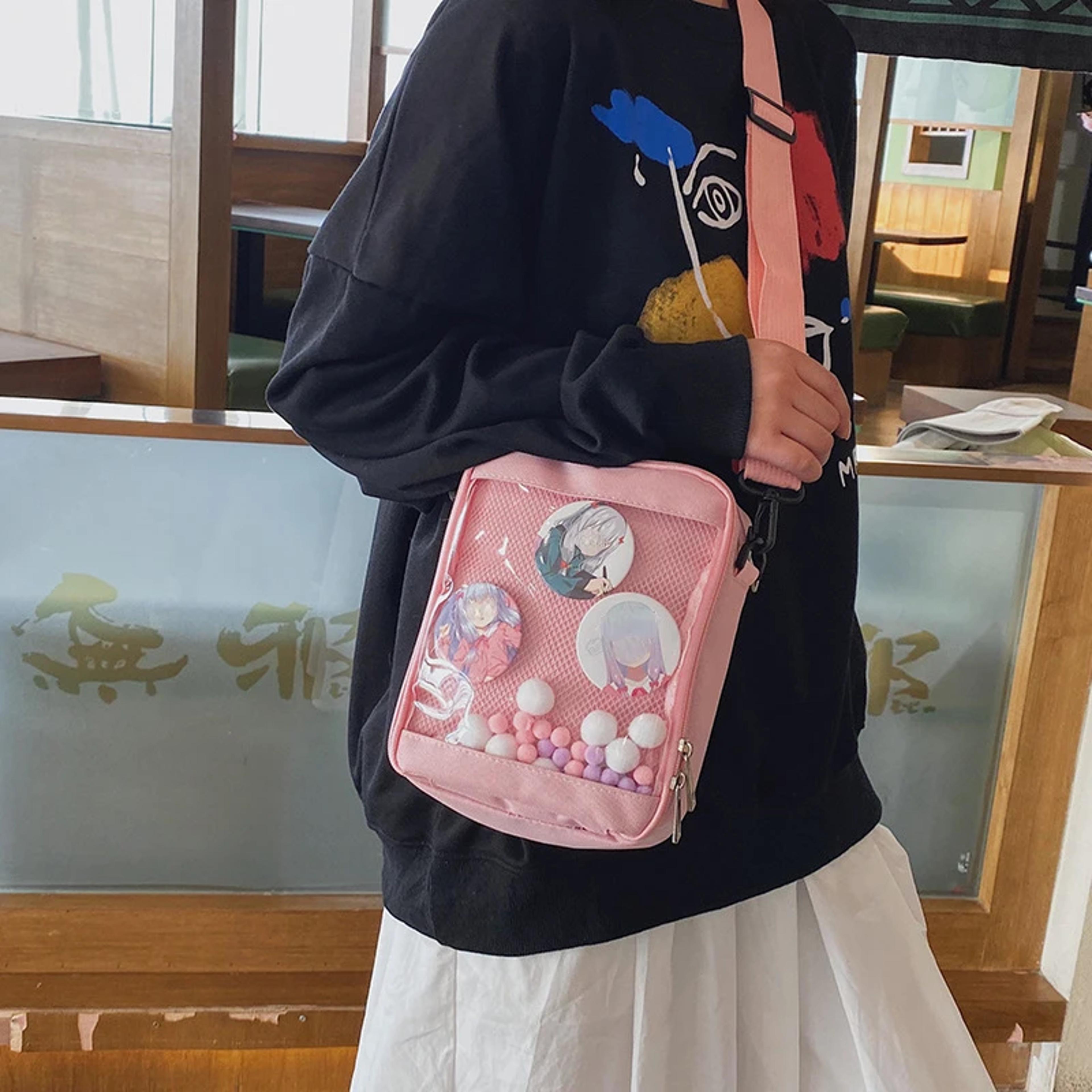 mini crossbody bag with transparent design and fur ball detail