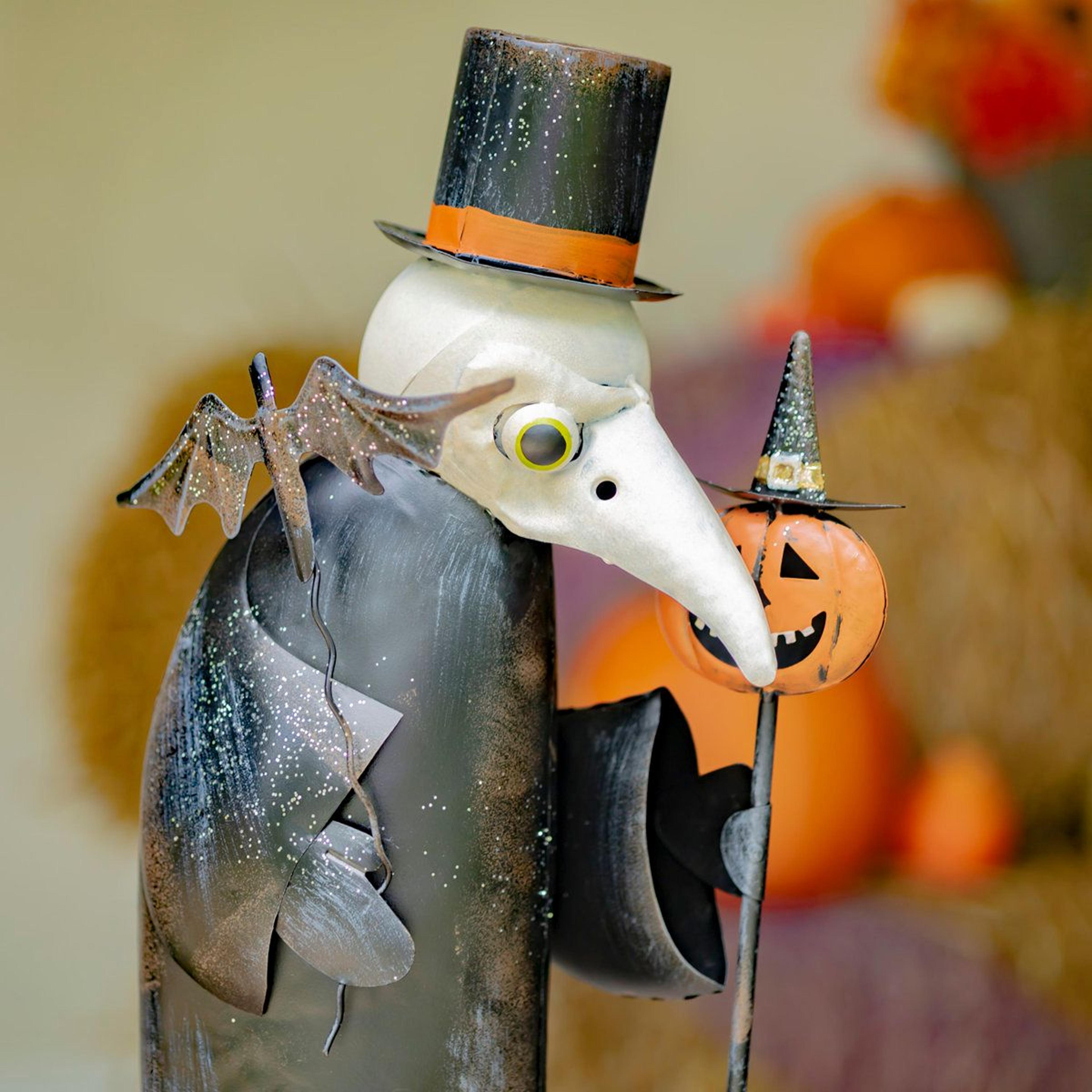 tall iron halloween vulture figurine with top hat and pumpkin cane
