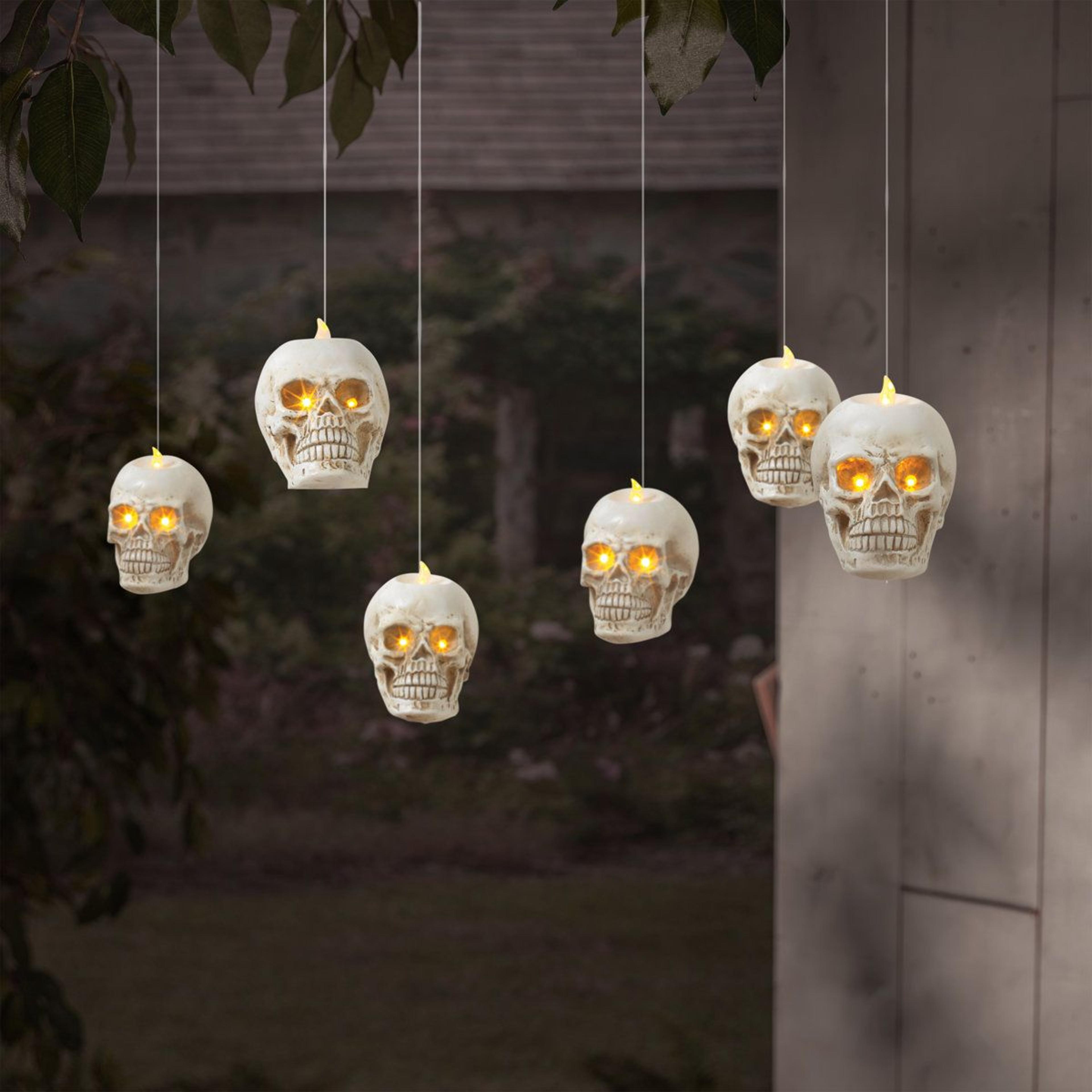 lighted hanging skulls warm white led halloween decorative accents remote and timer