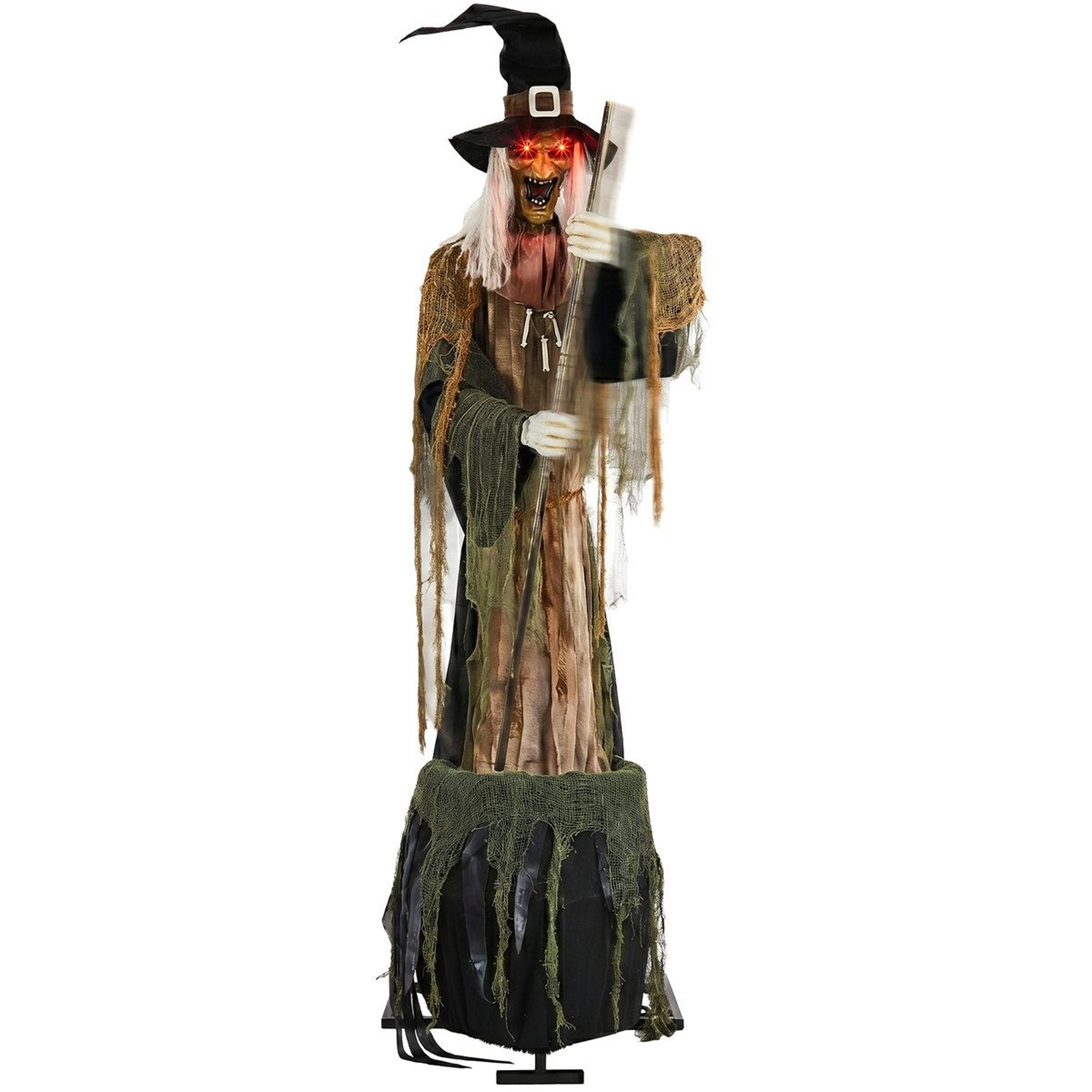 witch brewing poison with red glowing eyes and green cauldron light halloween decoration