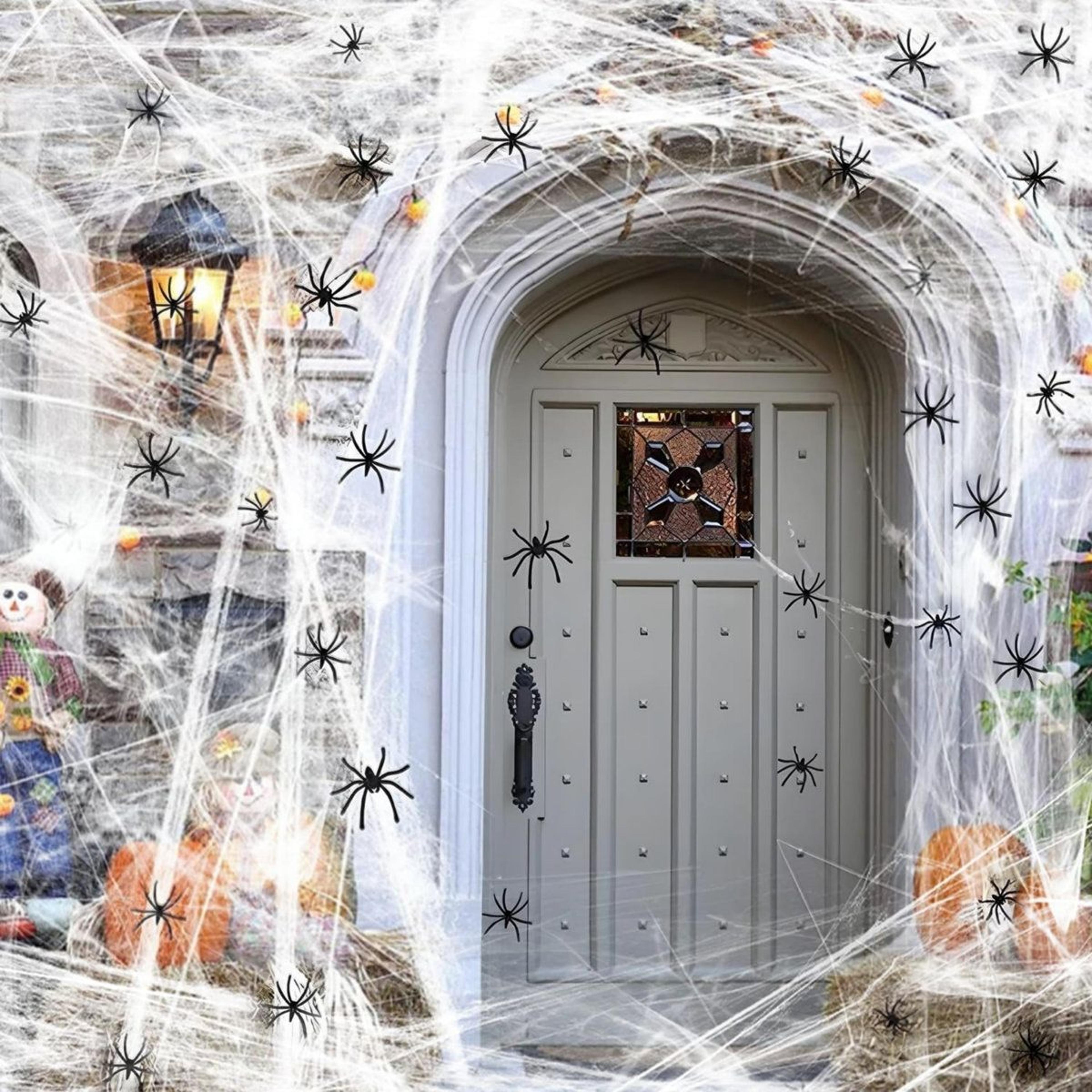 stretch spider web halloween decorations with fake spiders for indoor and outdoor use