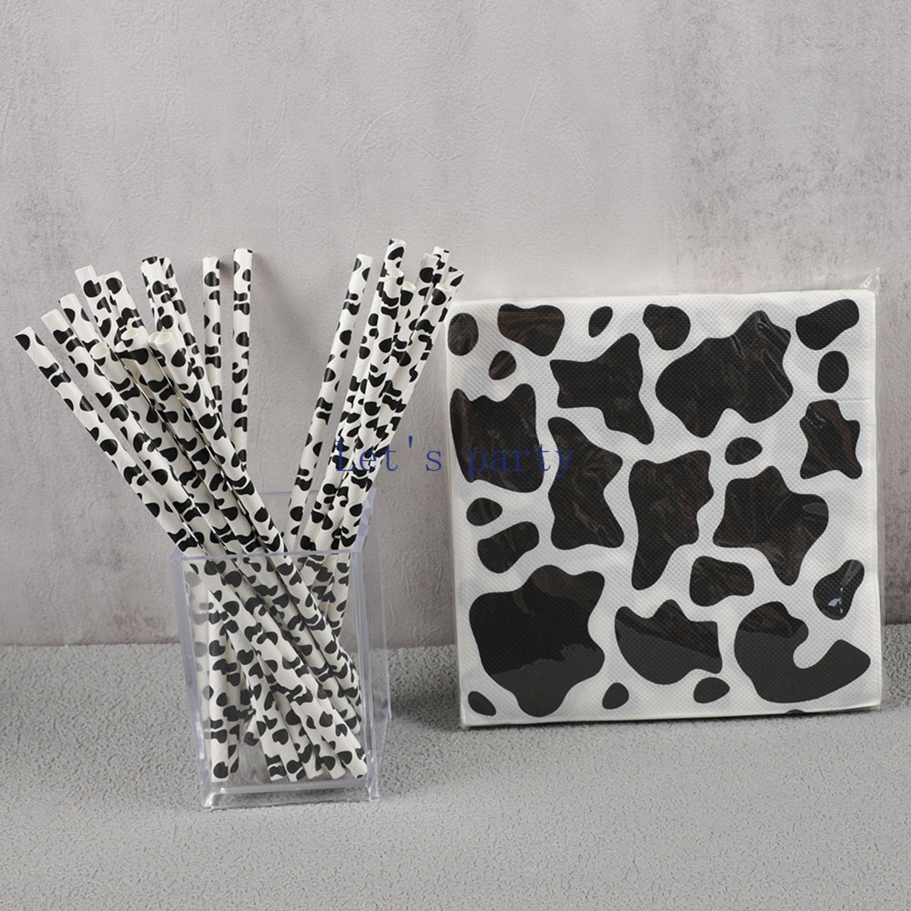 black & white cow theme party supplies with paper napkins & straws for birthdays & baby showers