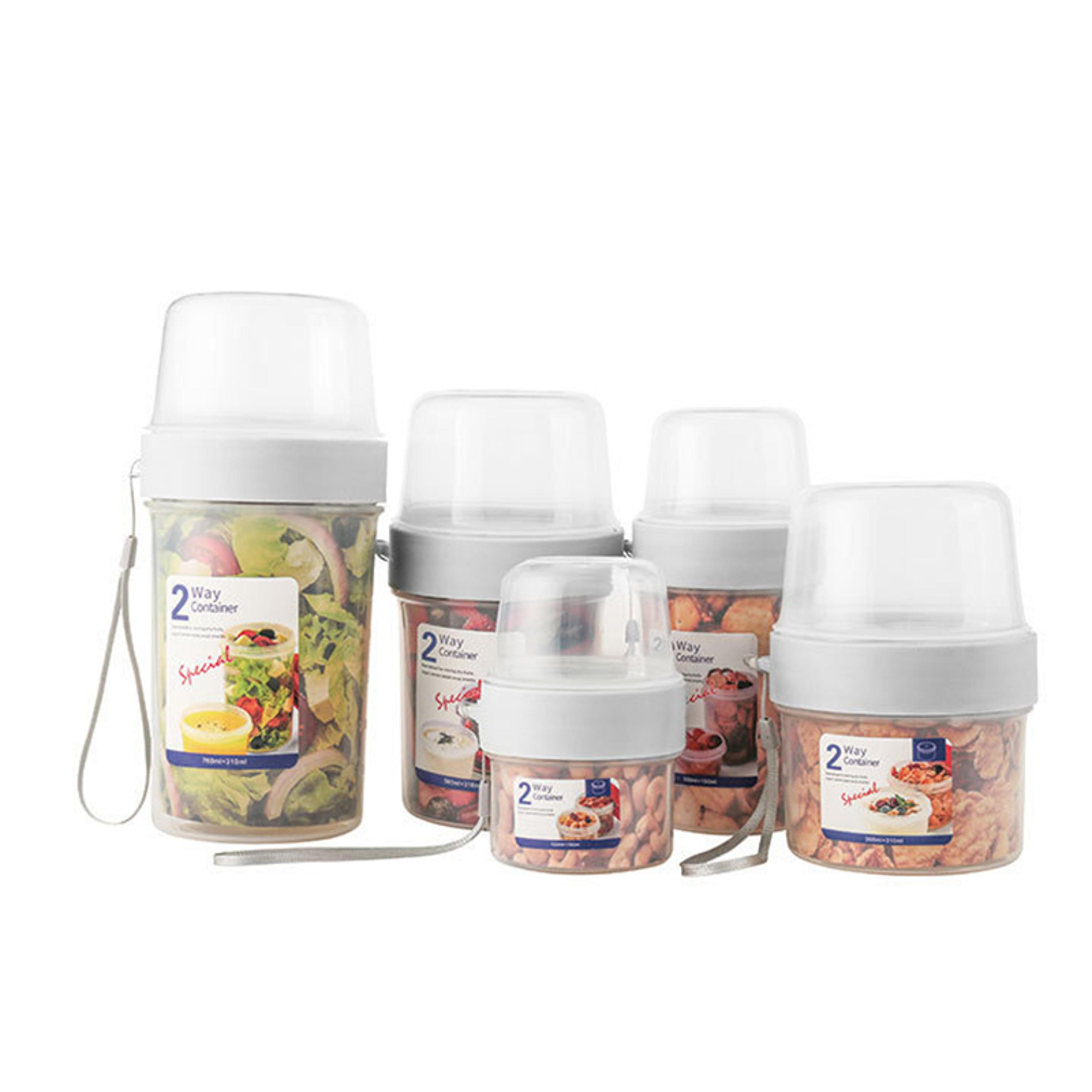 nutritious breakfast set: oatmeal cereal with yogurt, nuts, and salad in convenient sealable container for on-the-go mea