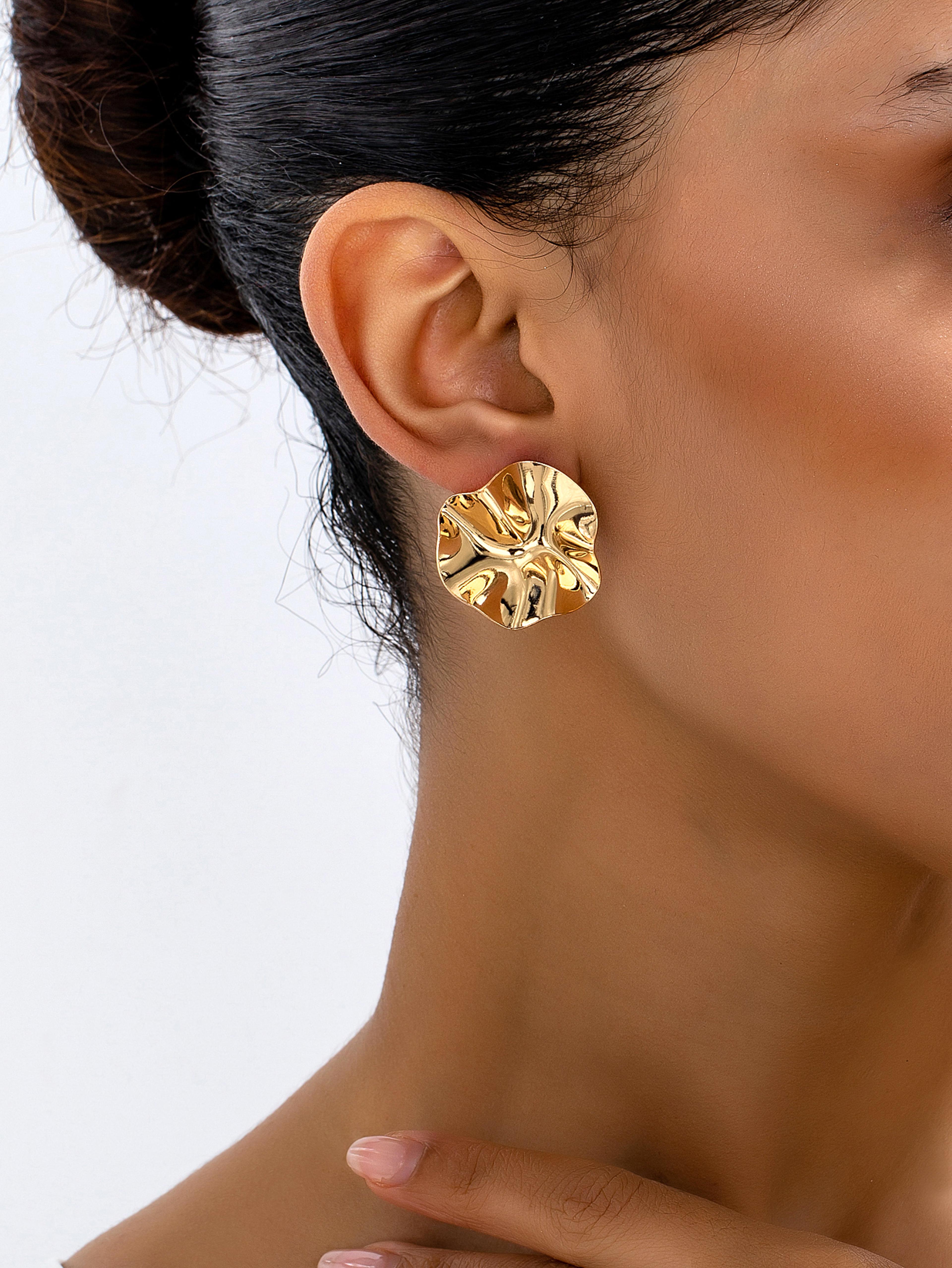 sculpted wavy gold petal earrings statement earrings with irregular textured design