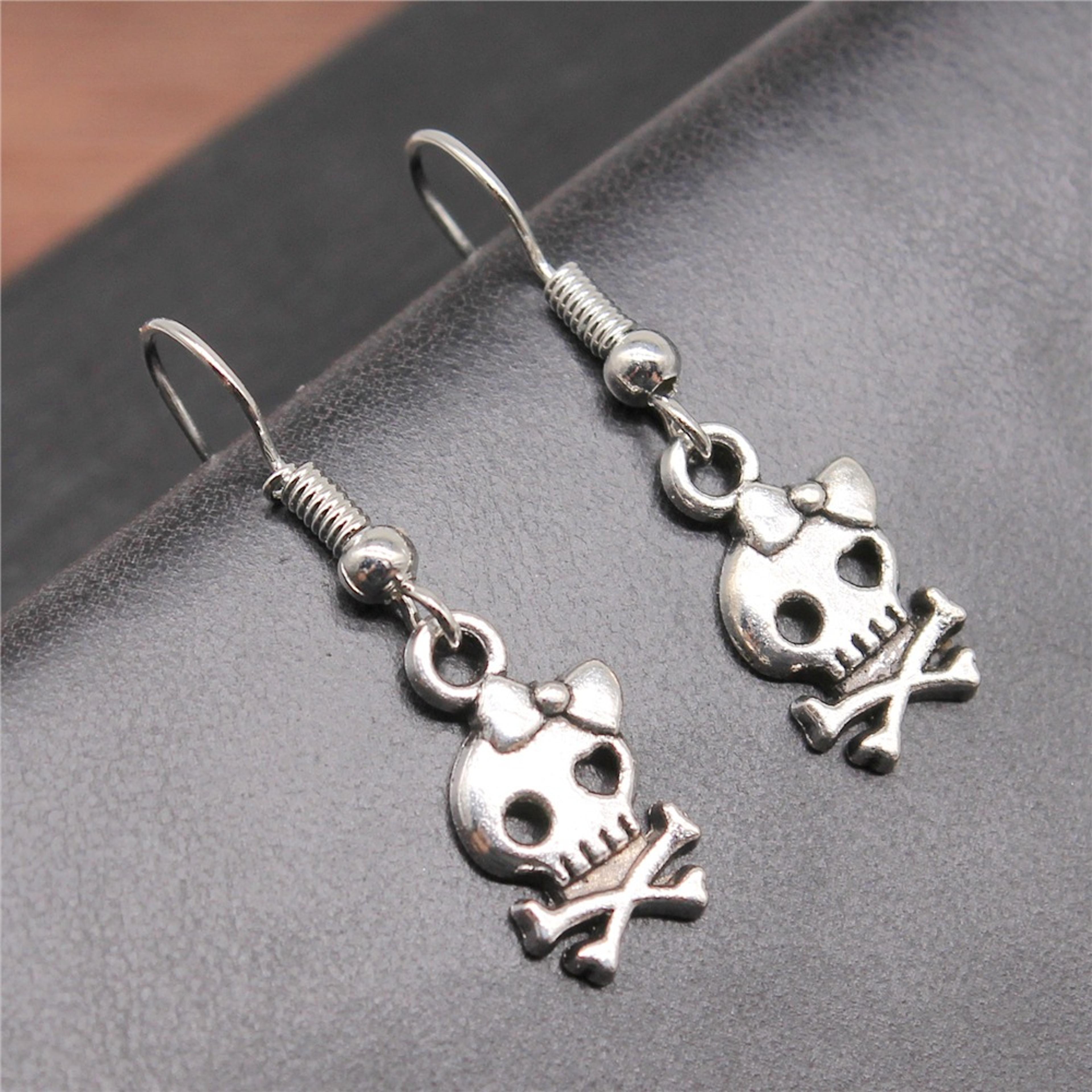 vintage gothic bow skull drop earrings in antique silver for women
