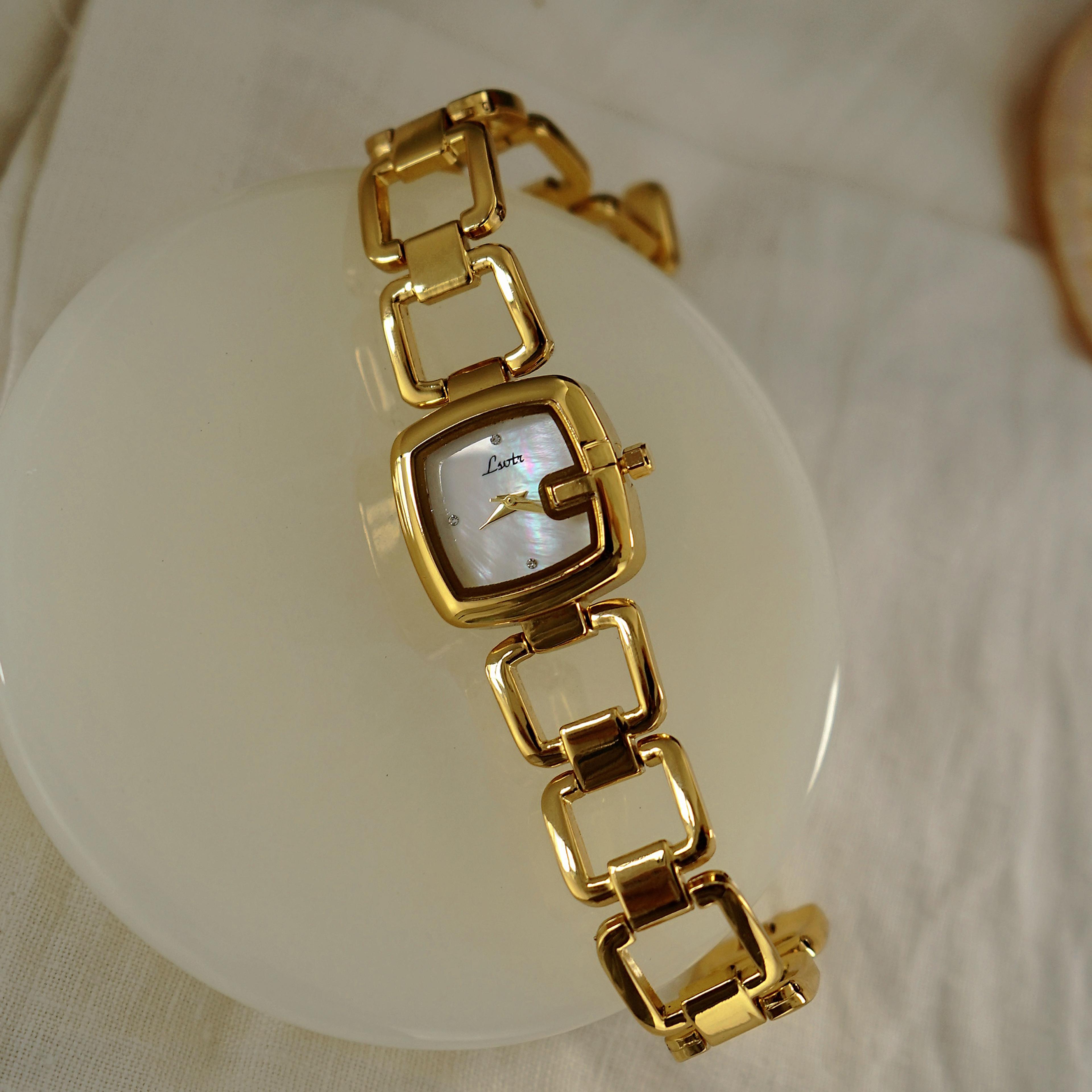 women's luxury quartz watch with mother of pearl dial & stainless steel bracelet