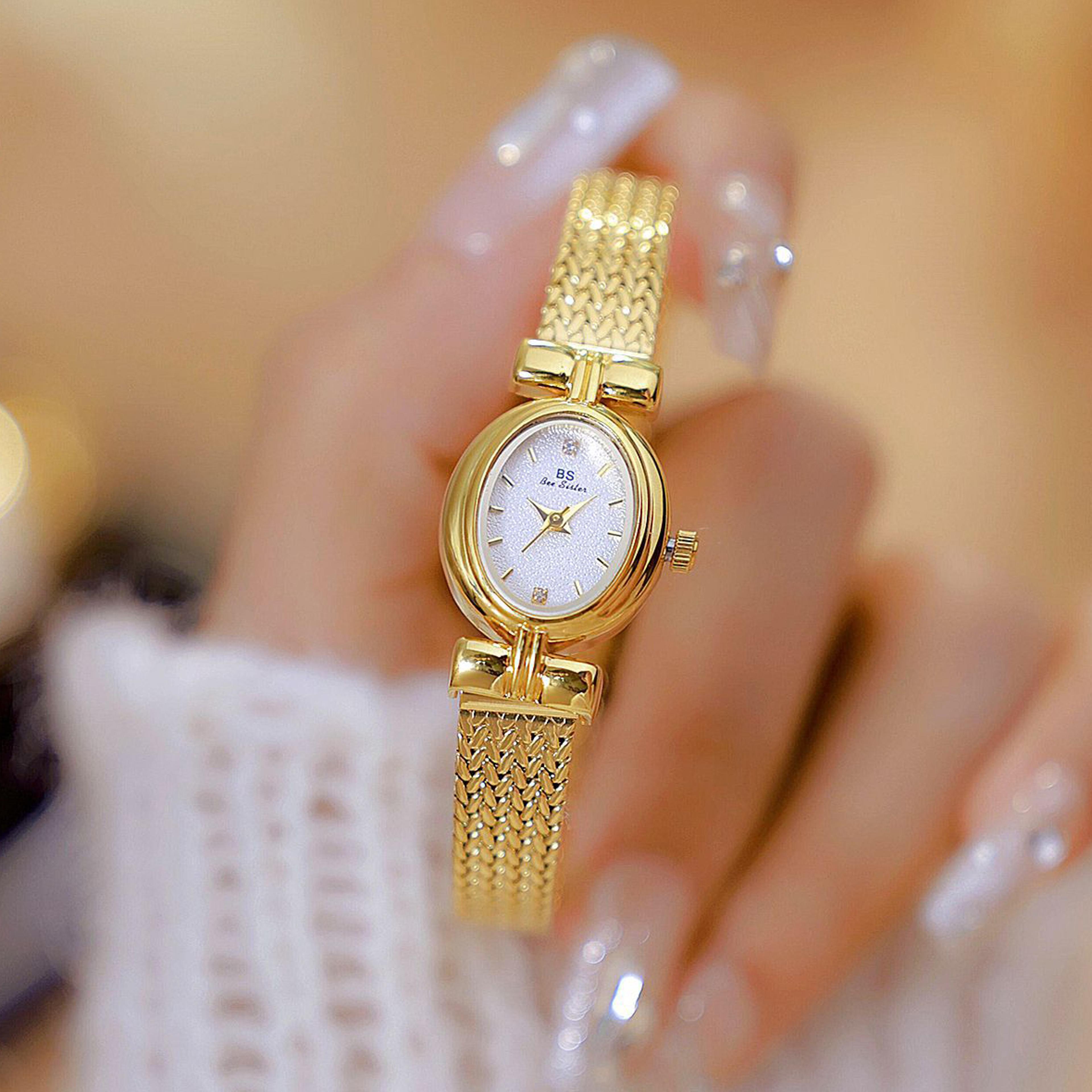 original women's vintage watch with oval dial & gold mesh strap quartz timepiece
