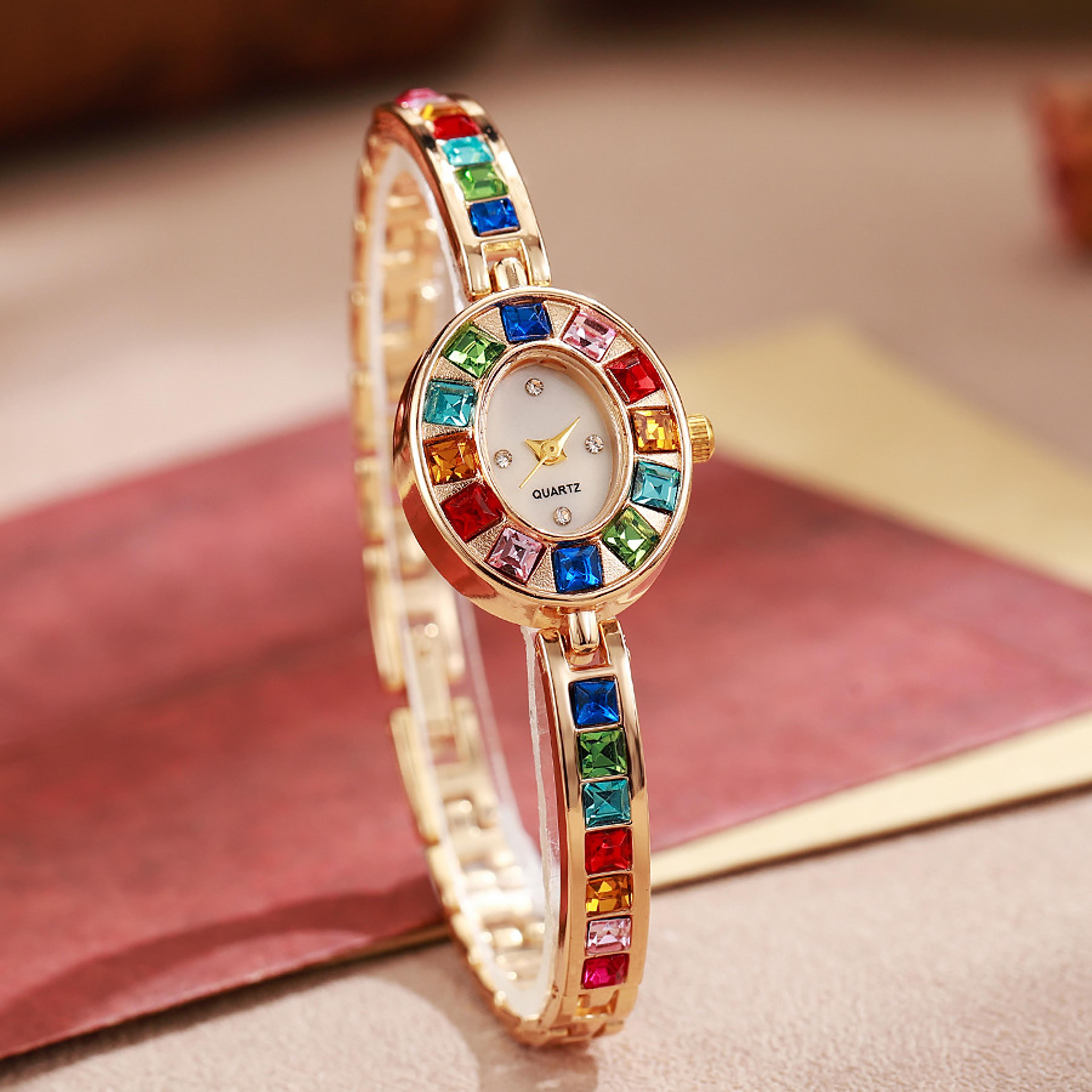 elegant women's bracelet watch with colorful diamond accent oval quartz dial
