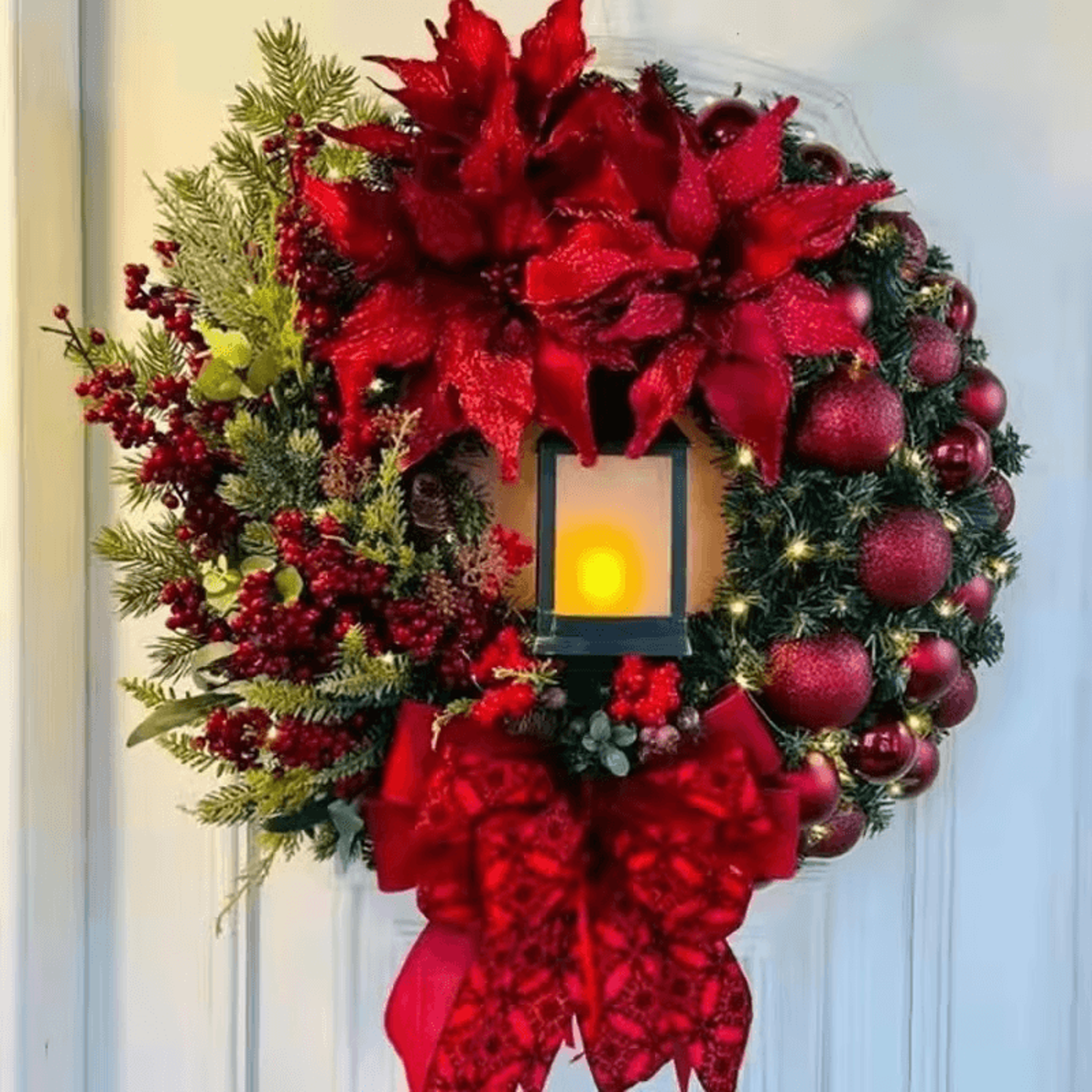 cordless pre-lit christmas wreath with led lantern & bow for doors & holiday walls