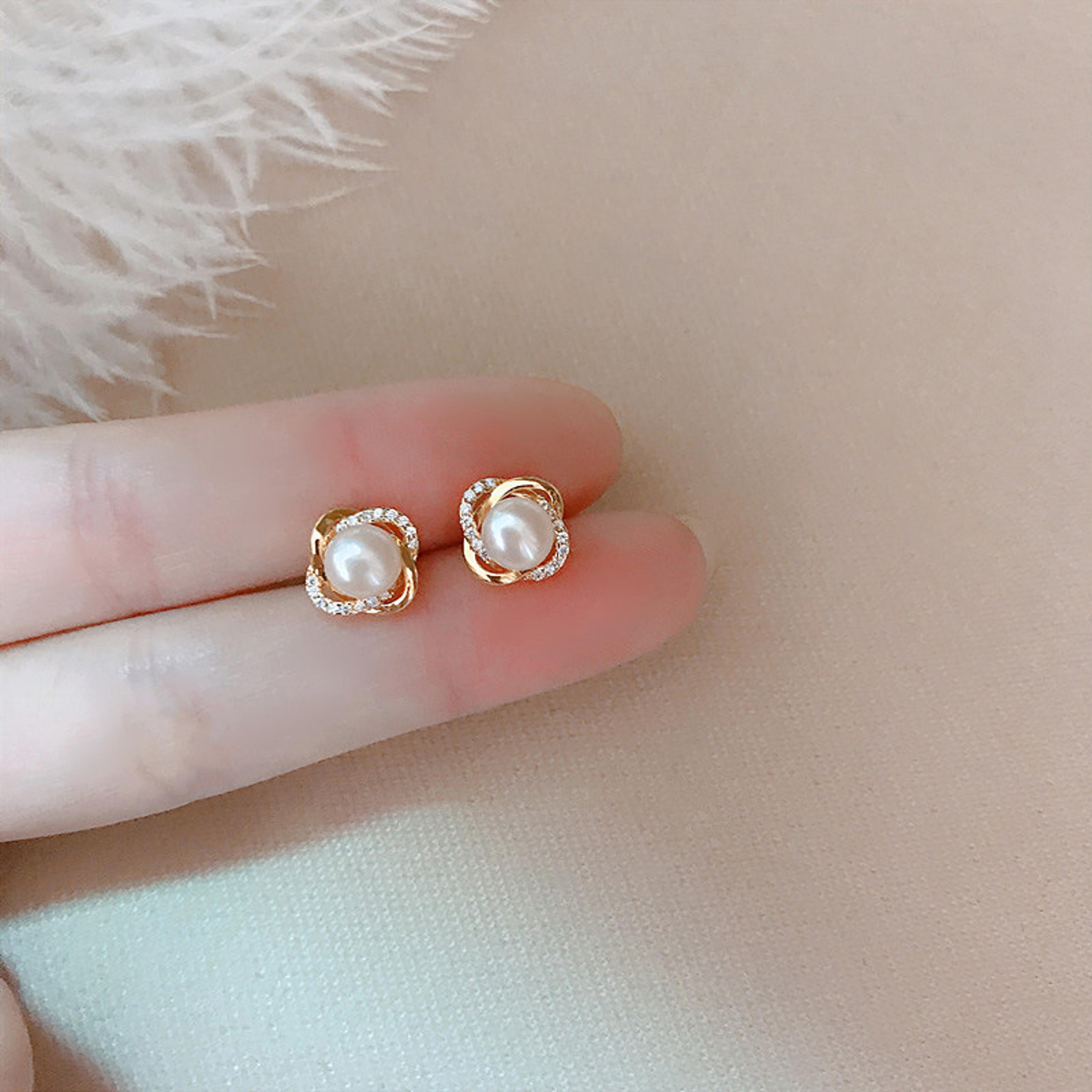 upscale 14k gold earrings with zircon pearl twist - luxury studs for women