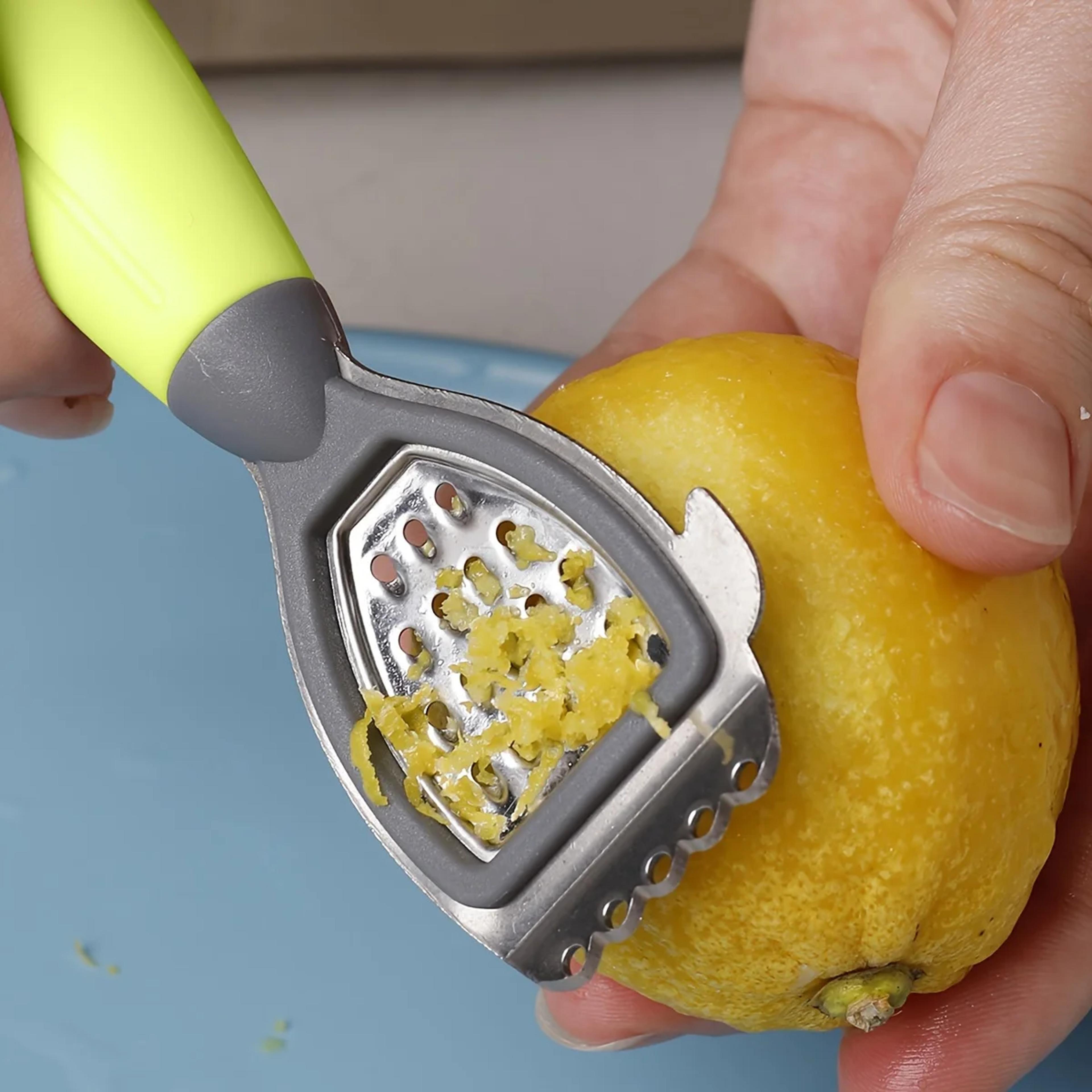 multifunctional lemon zester and citrus juicer kitchen gadget with stainless steel blade