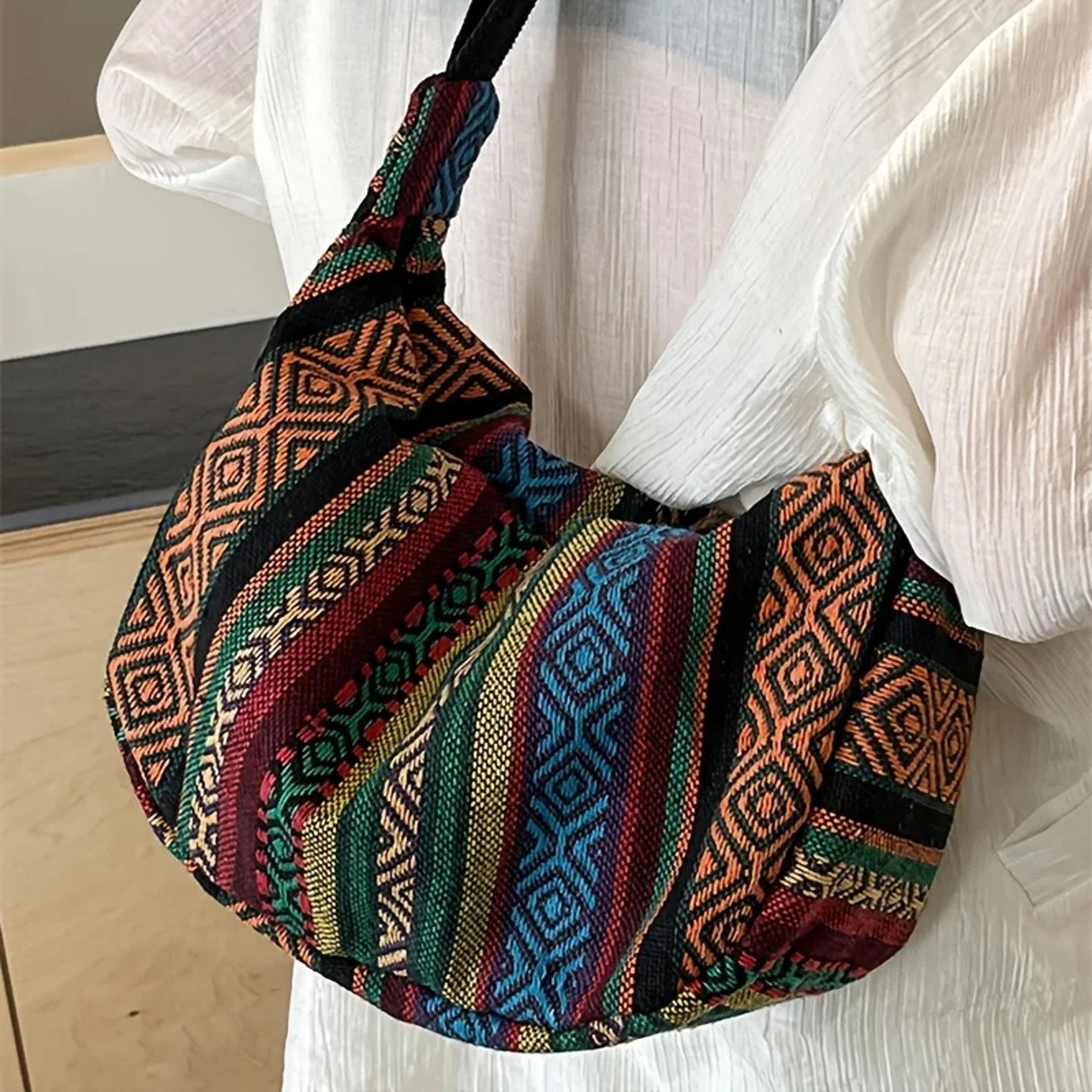 tribal style foldable crossbody bag with striped shoulder design