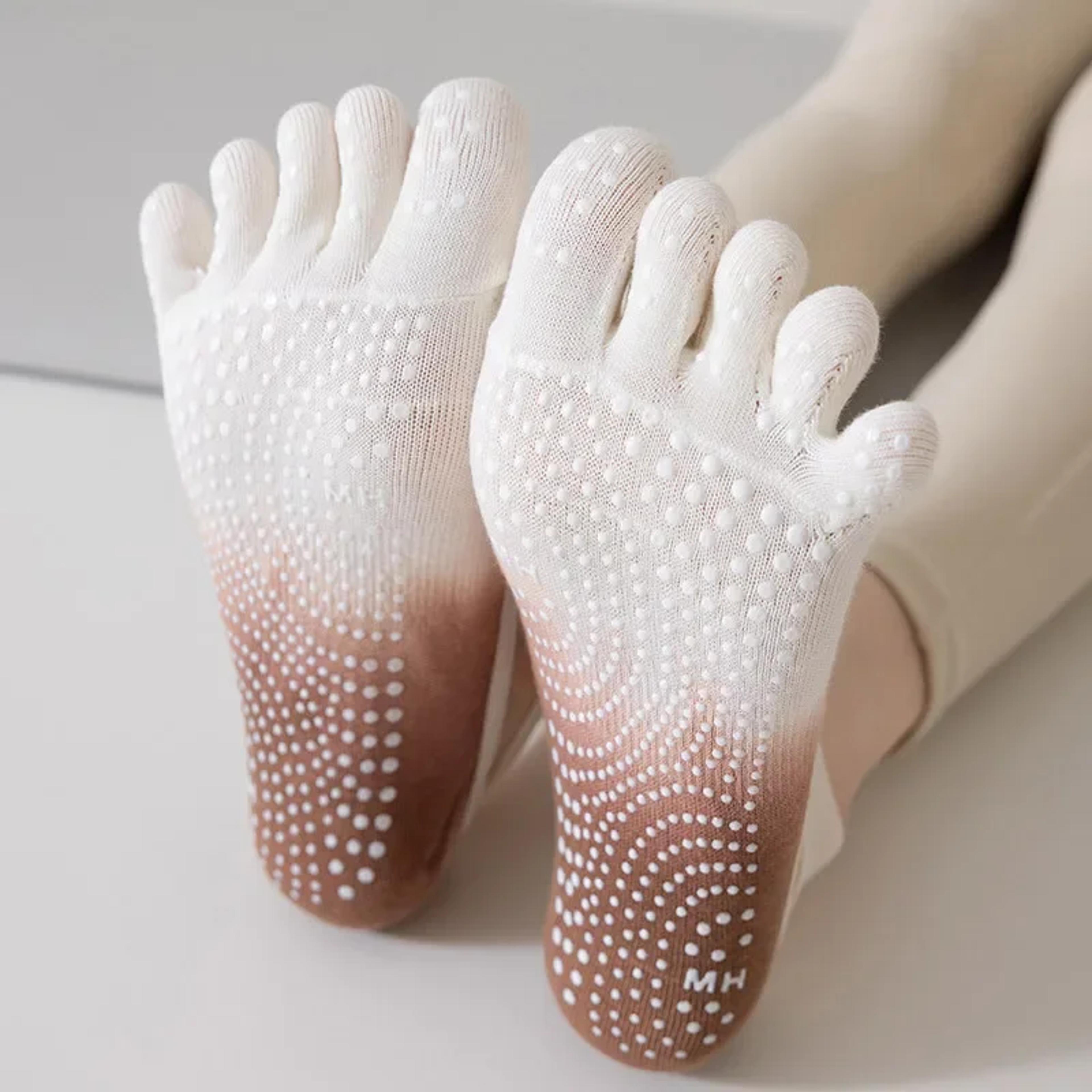 five toe yoga grip socks for women with non slip silicone soles and breathable ballet straps