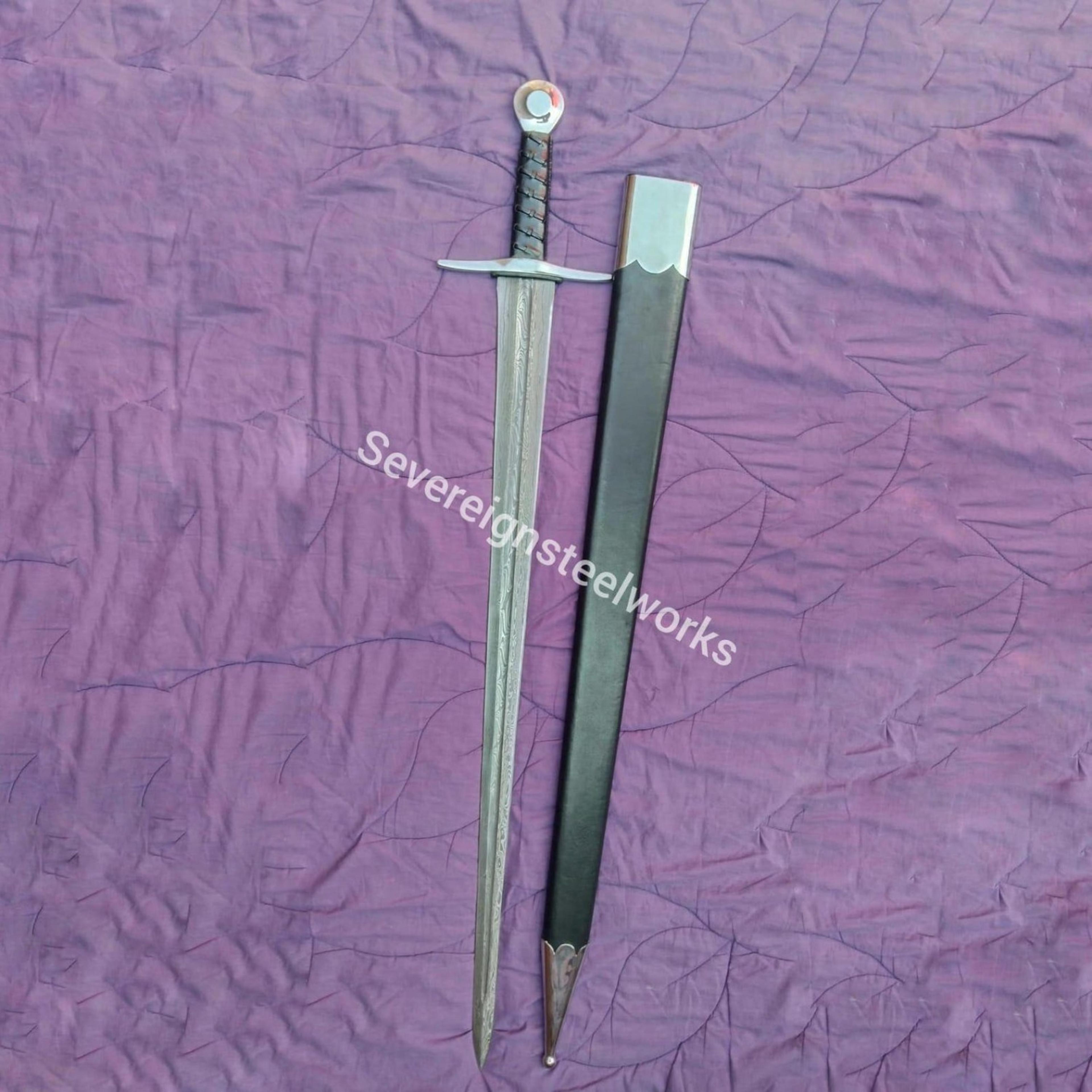 ring pommel medieval sword with slender fullered blade, black wrapped hilt & fitted scabbard, historic warrior display