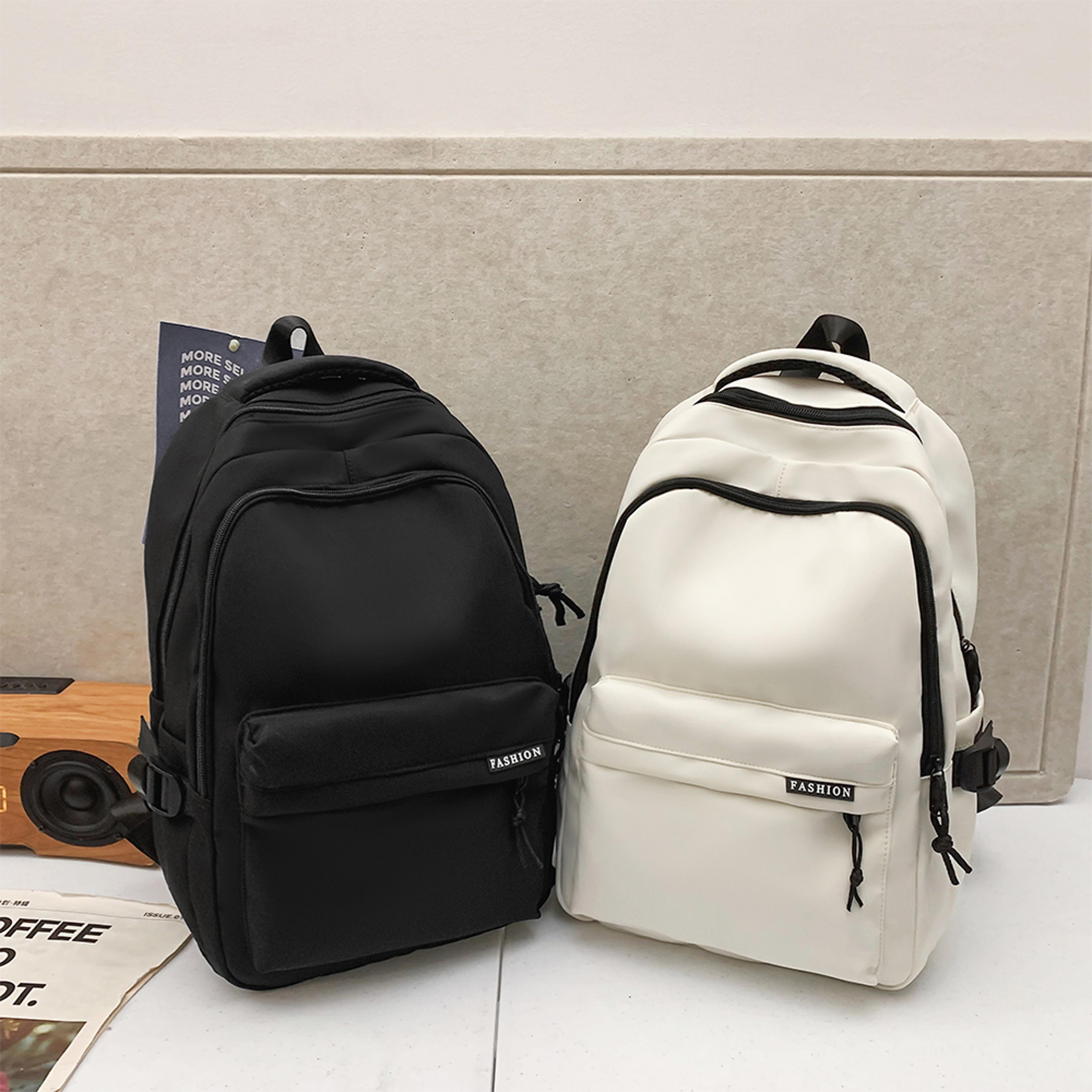 simple black travel backpack for middle school students, large capacity solid color backpack for high school students