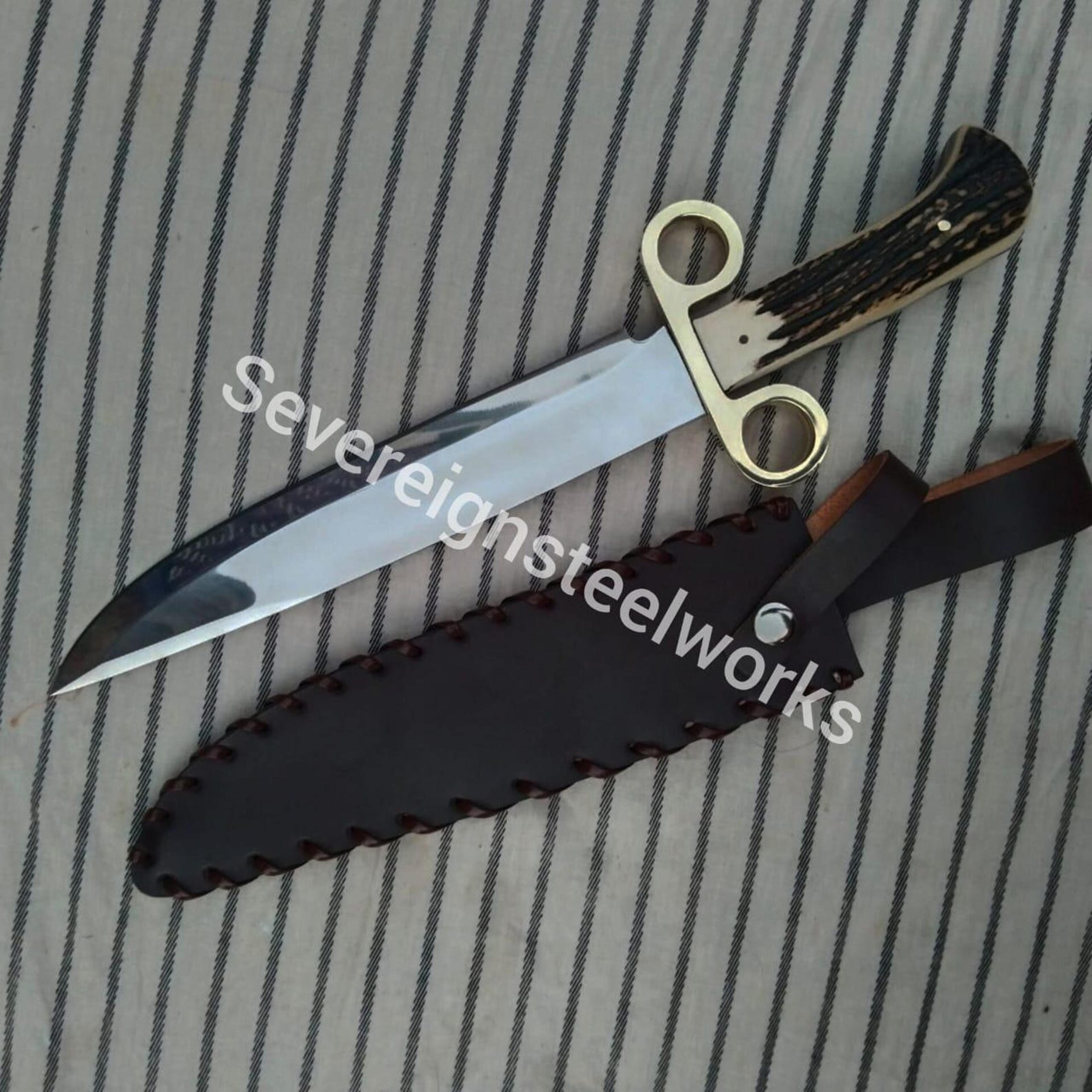 western tombstone-style carbon steel knife with stag antler handle, brass ring guard & leather sheath