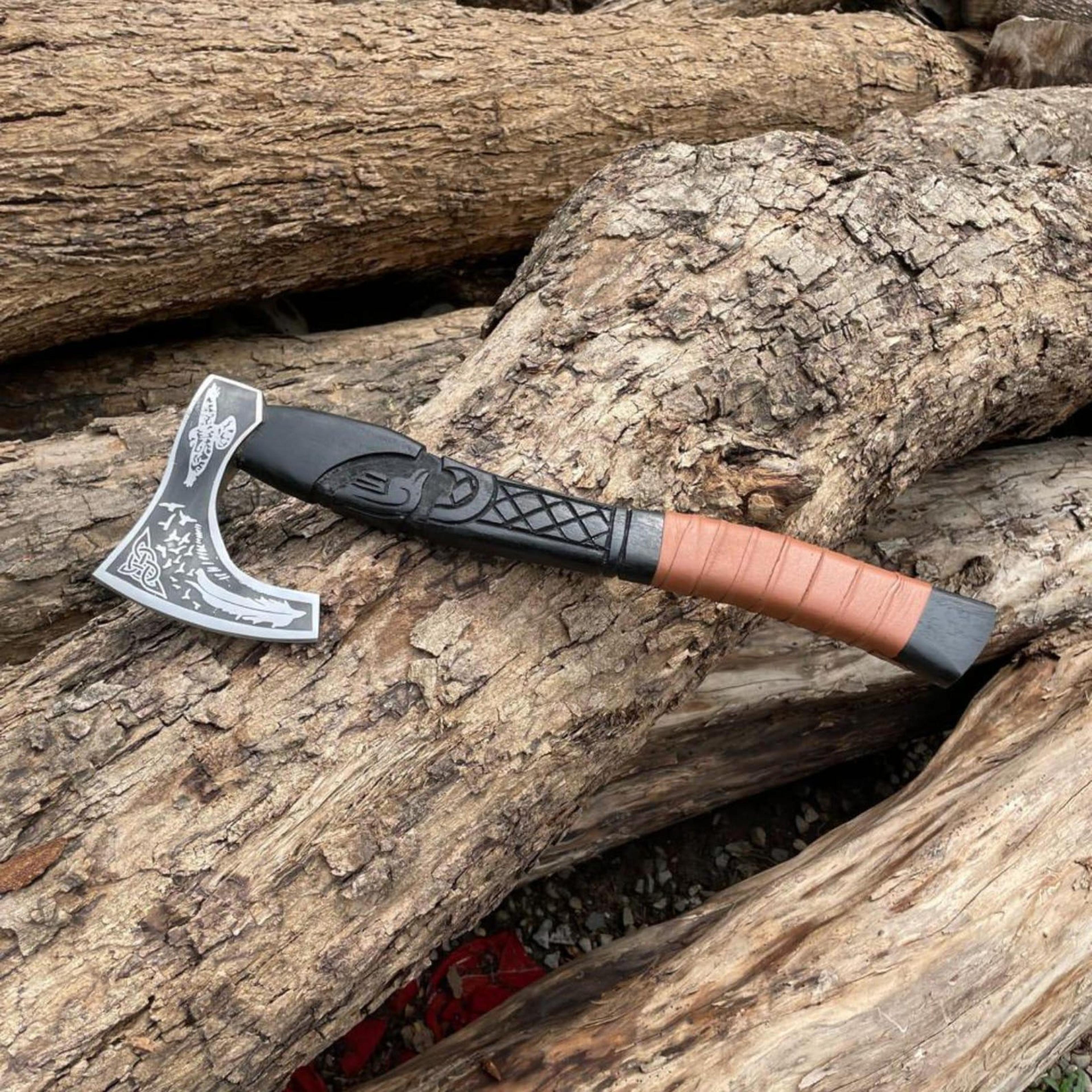 handmade viking bearded axe with engraved steel head, carved black wood handle & leather-wrapped grip
