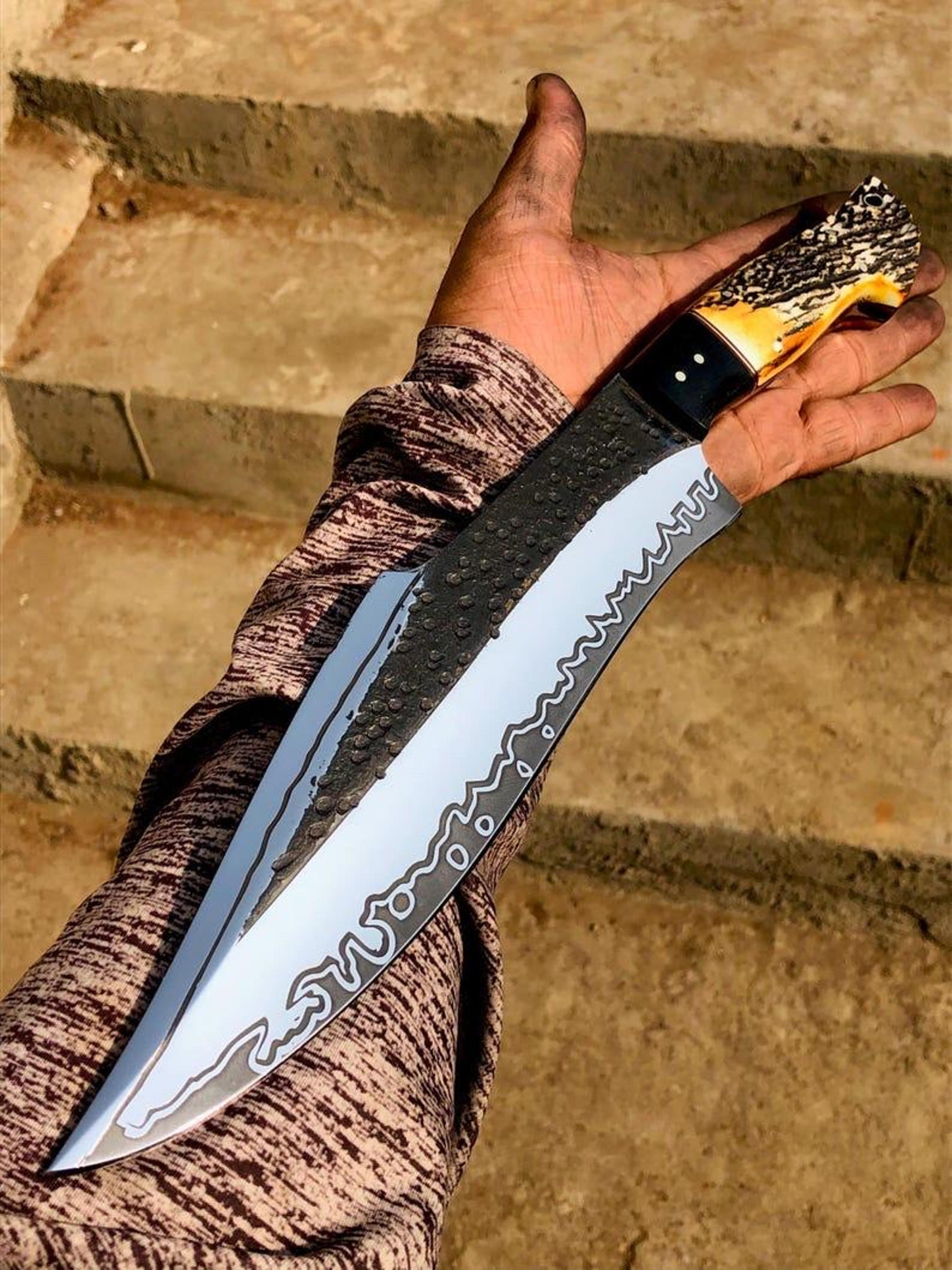 handcrafted carbon steel bowie knife with antler handle and high-quality leather sheath