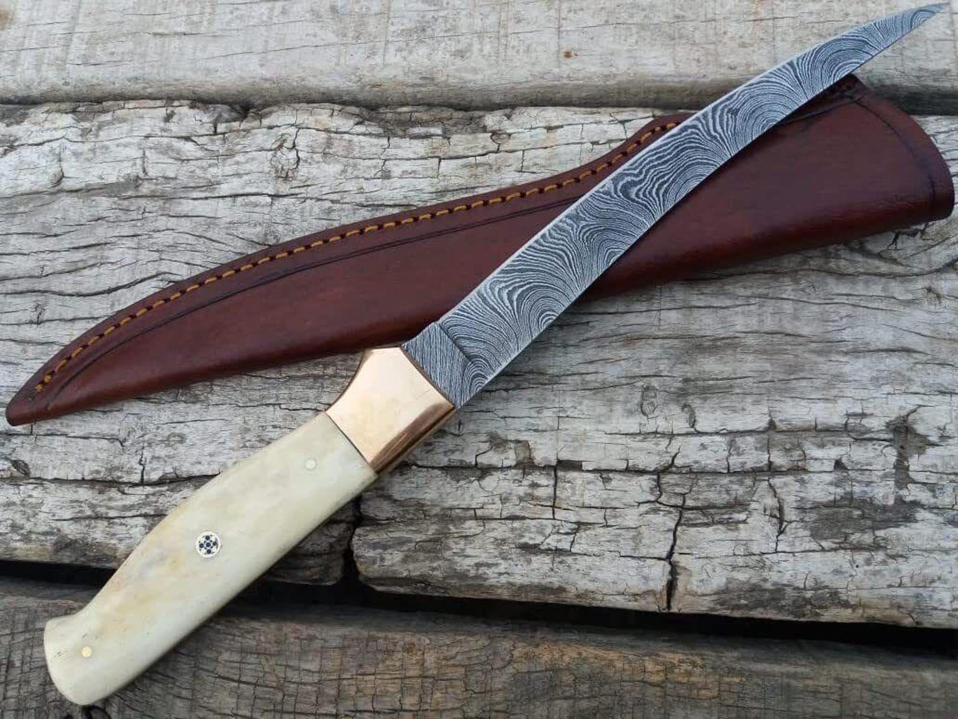 handmade damascus steel fillet knife with cow bone handle and leather sheath for outdoor activities