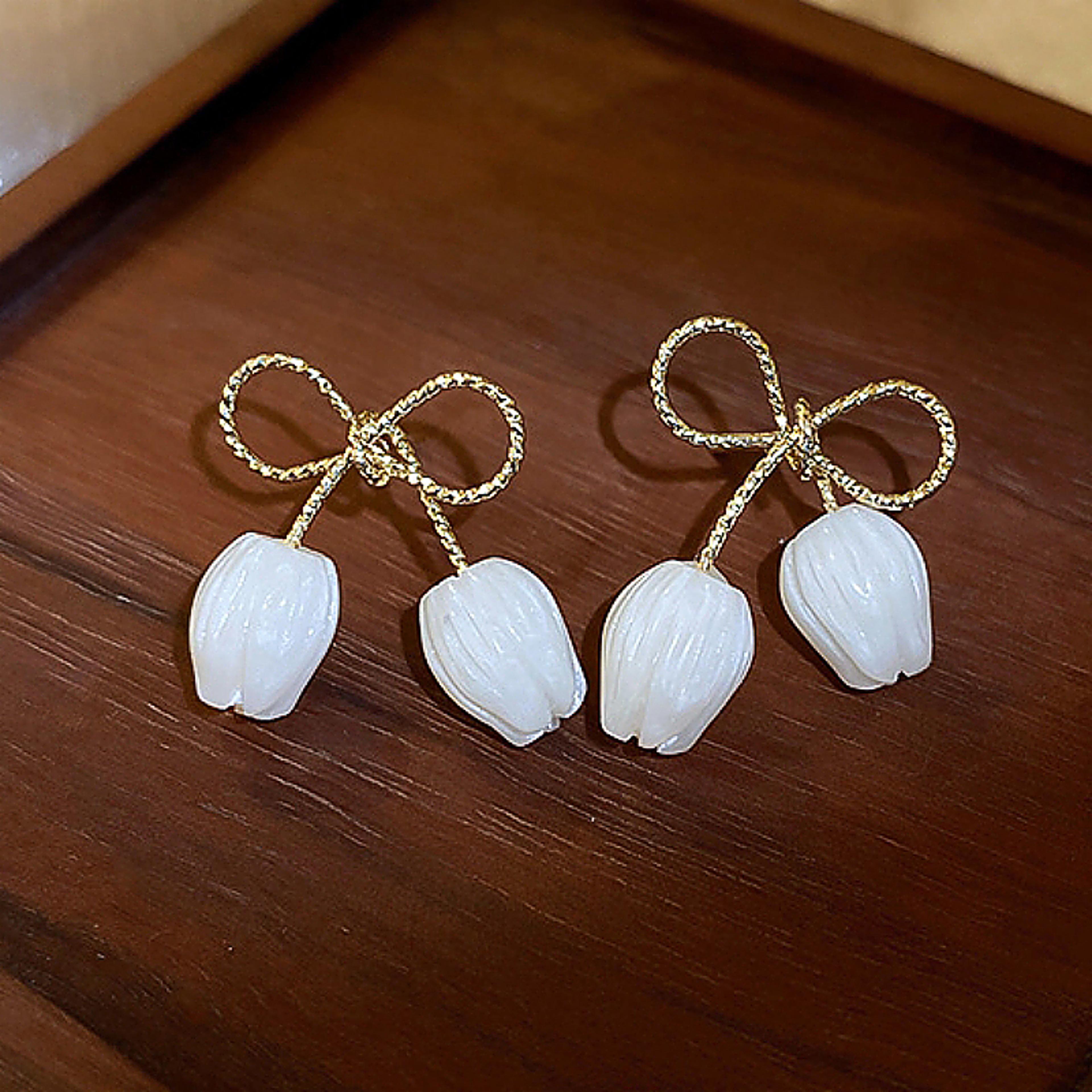 elegant tulip bloom stud earrings white flower bridal earrings with gold bow accent