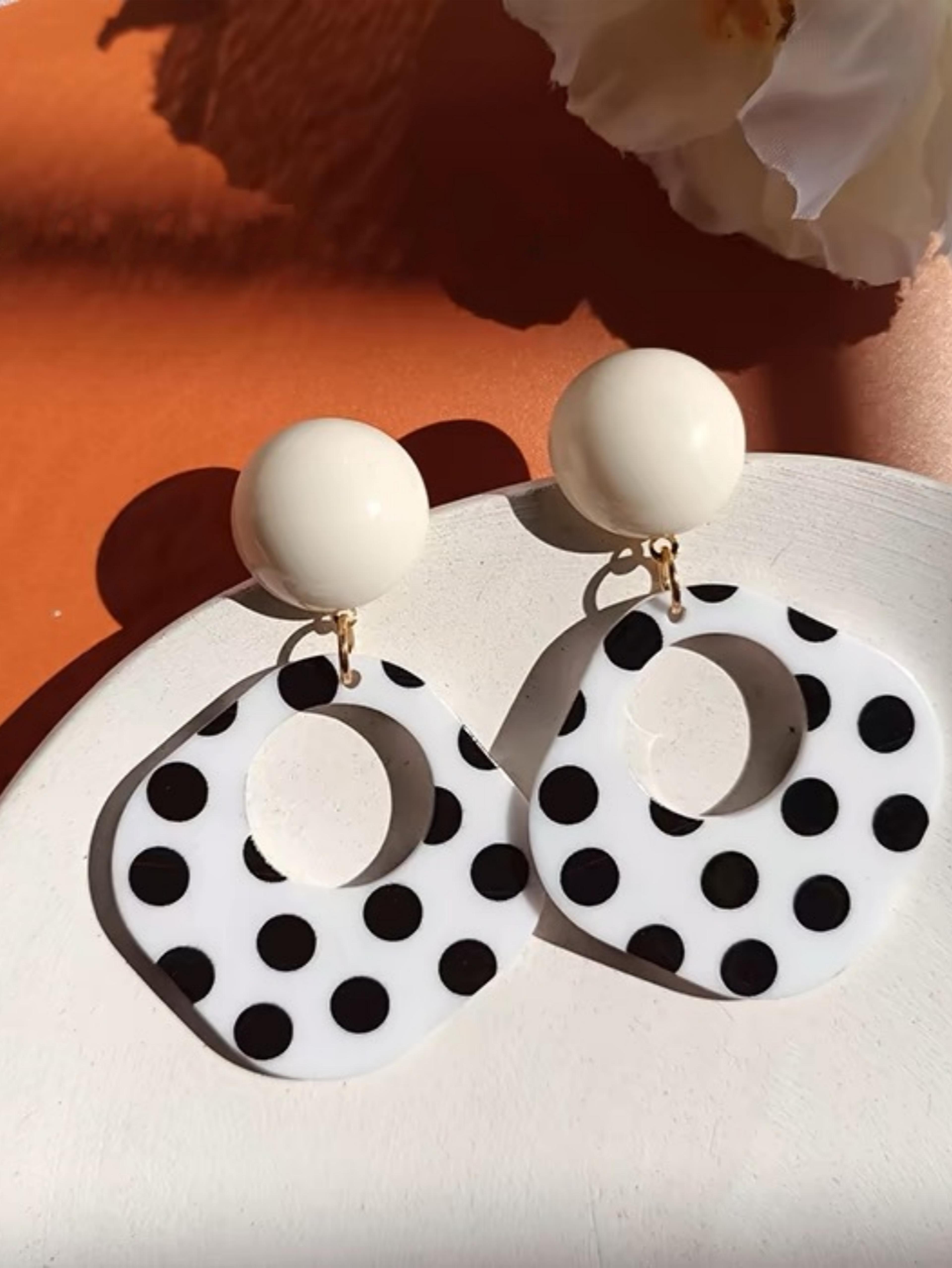a pair of black and white large polka dot hollow geometric shape nostalgia harbor wind earrings