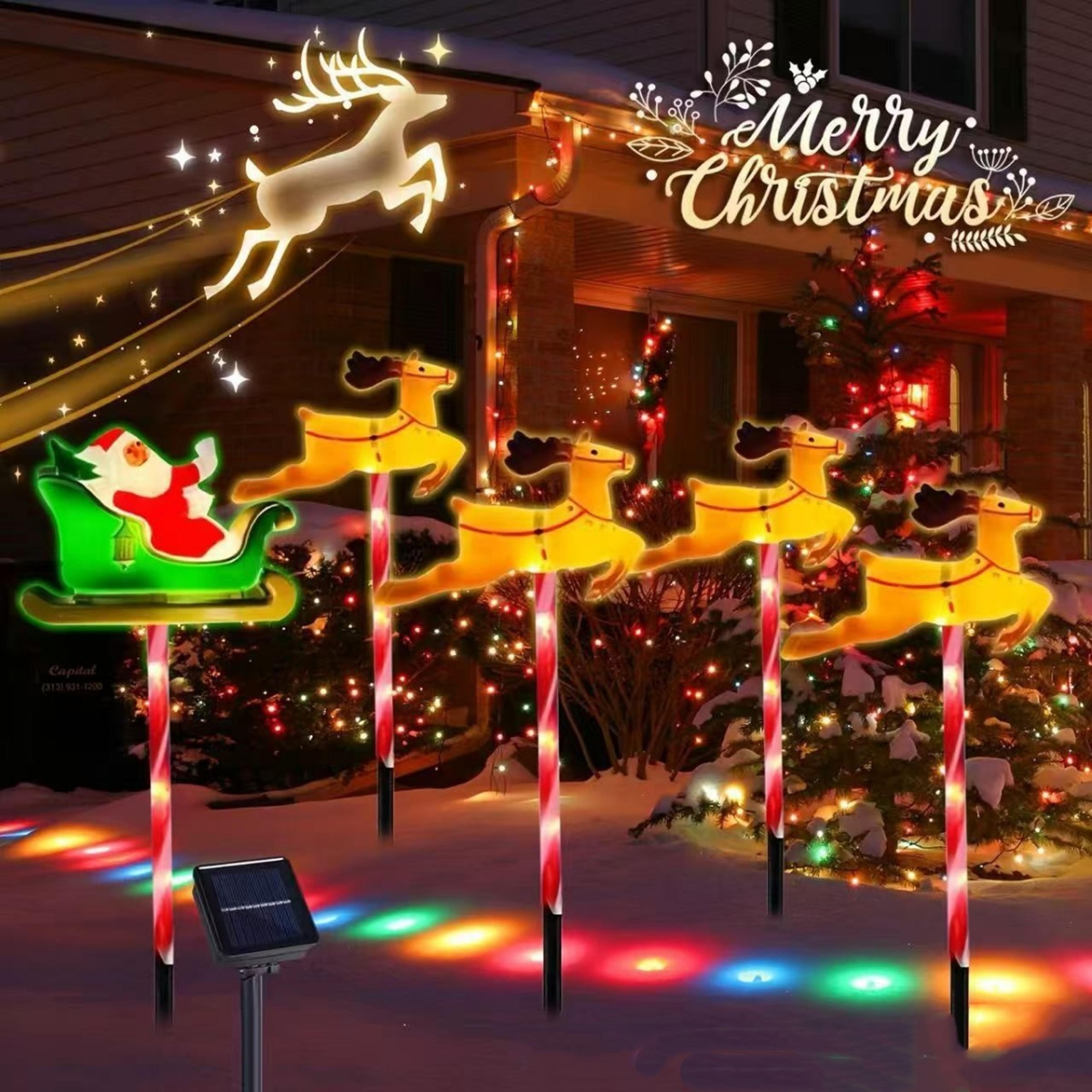 deer pulling car santa claus holiday decoration, outdoor lawn lights grounding atmosphere ornament