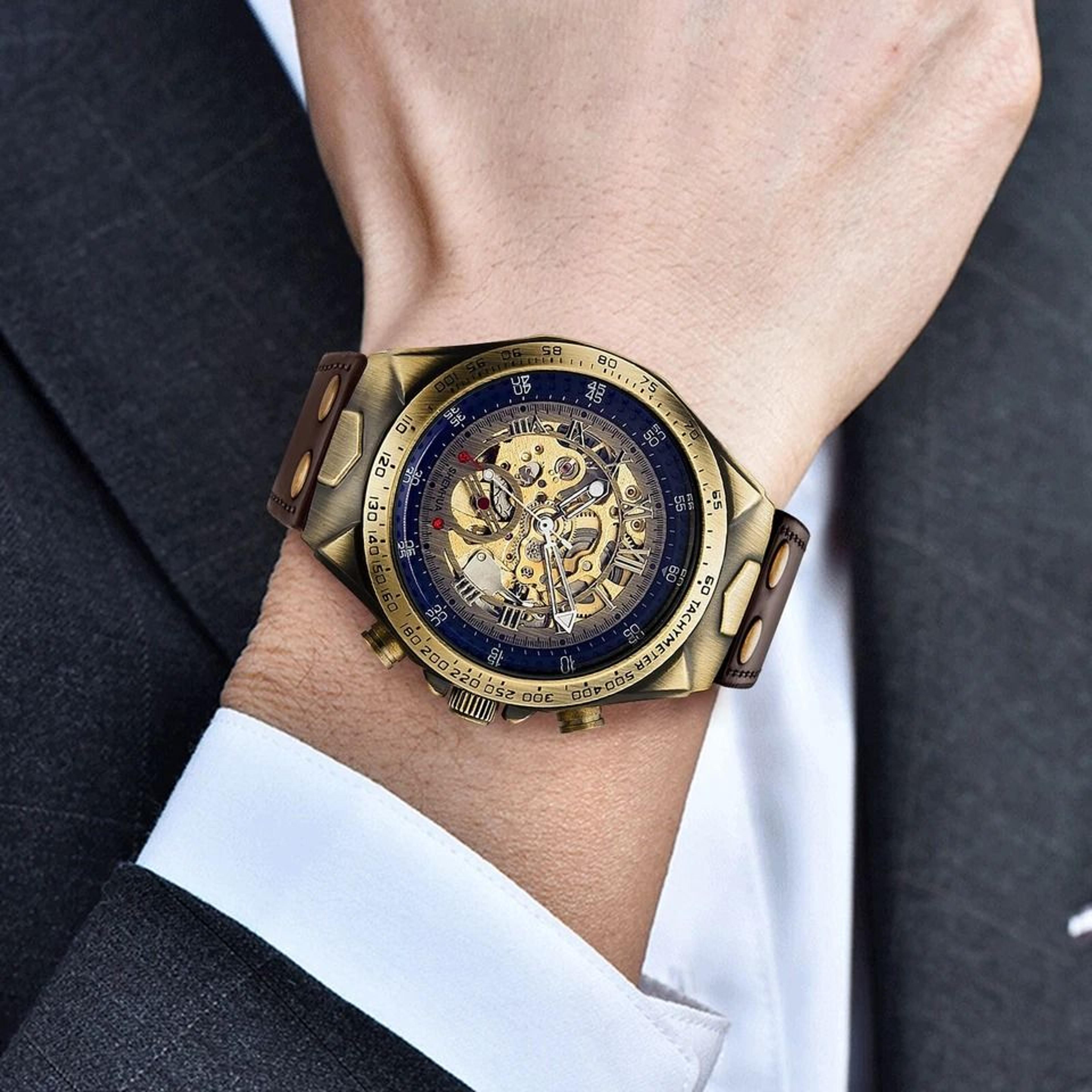 gold tone skeleton luxury men's automatic mechanical watch, retro leather strap, water resistant, classic design