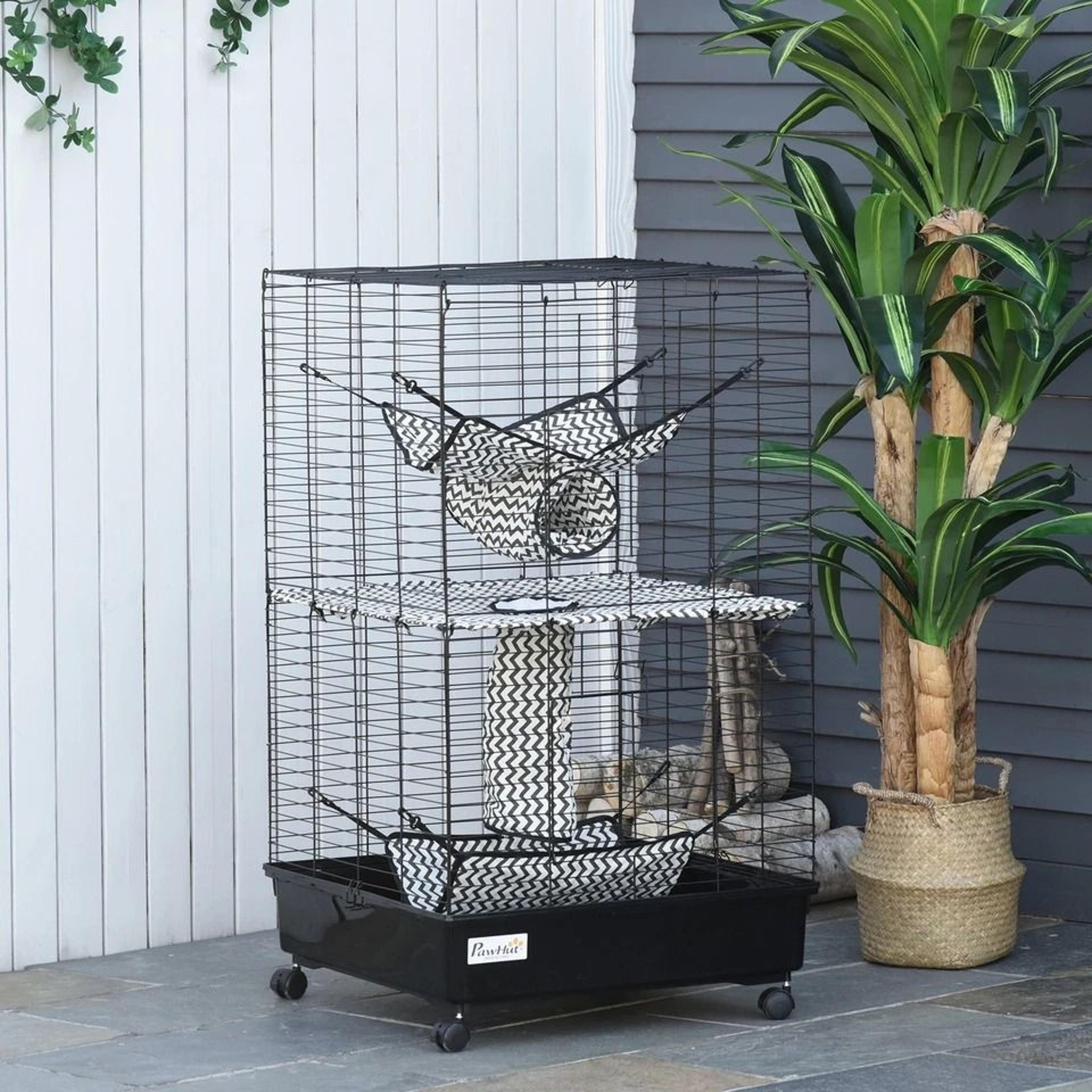 small animal habitat playhouse for ferrets with wheels, hammocks, and tunnels