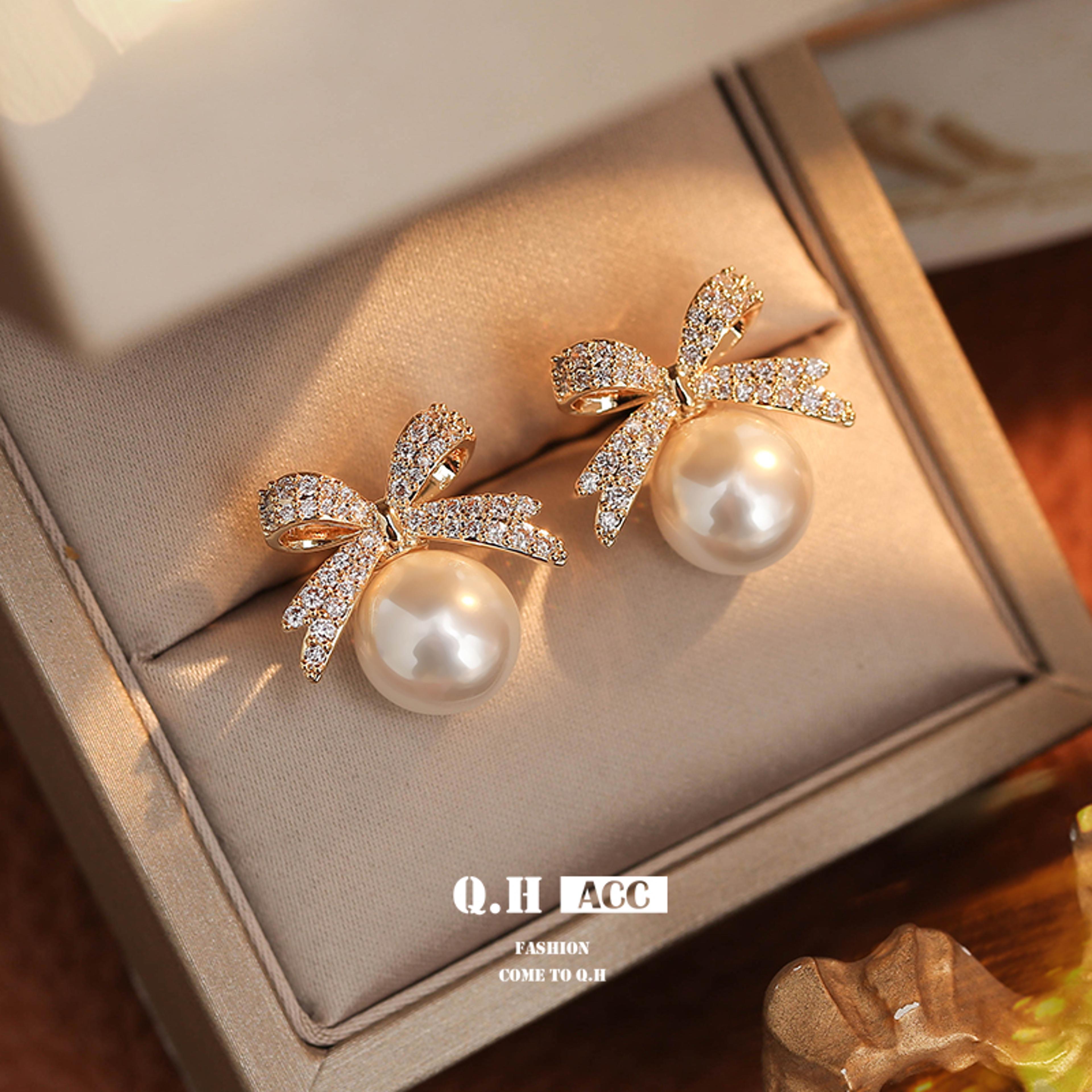 pearl bow drop earrings with zinc alloy metal and simulated pearl detail