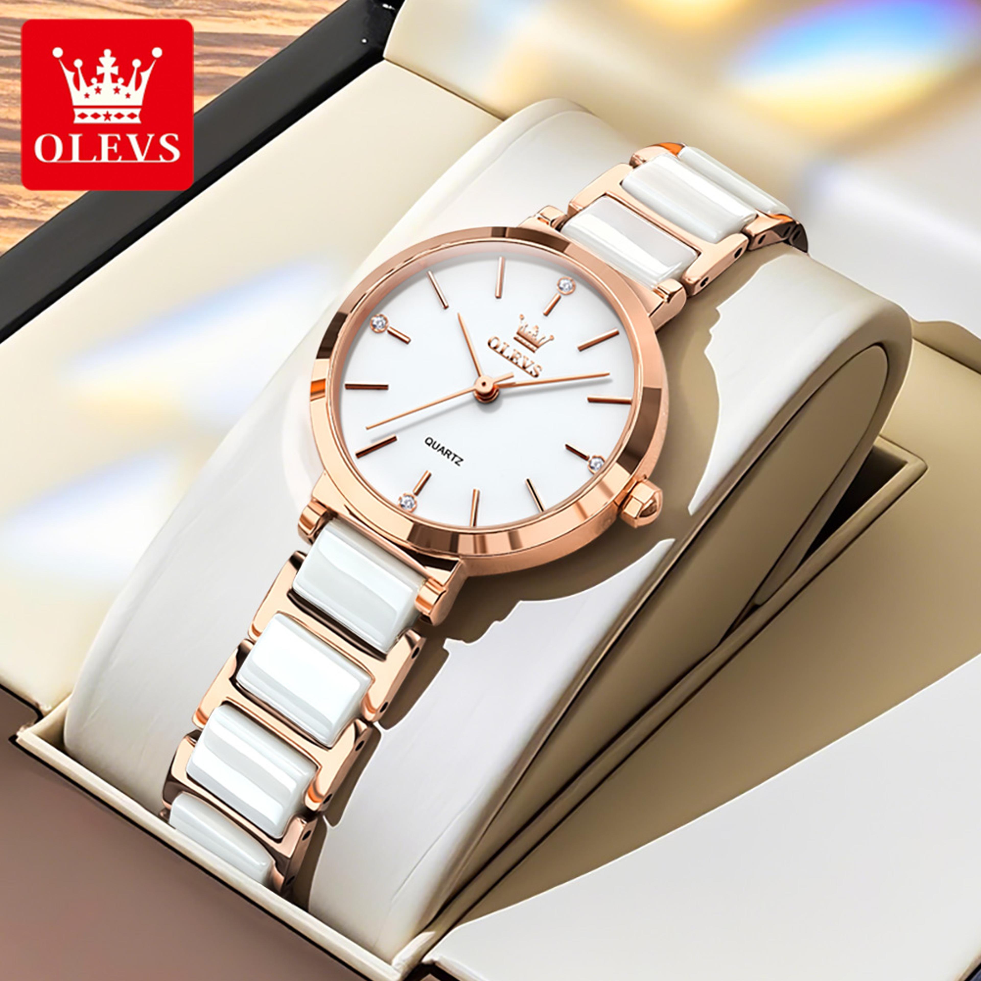 women's rose gold quartz watch with ceramic-style band and date display