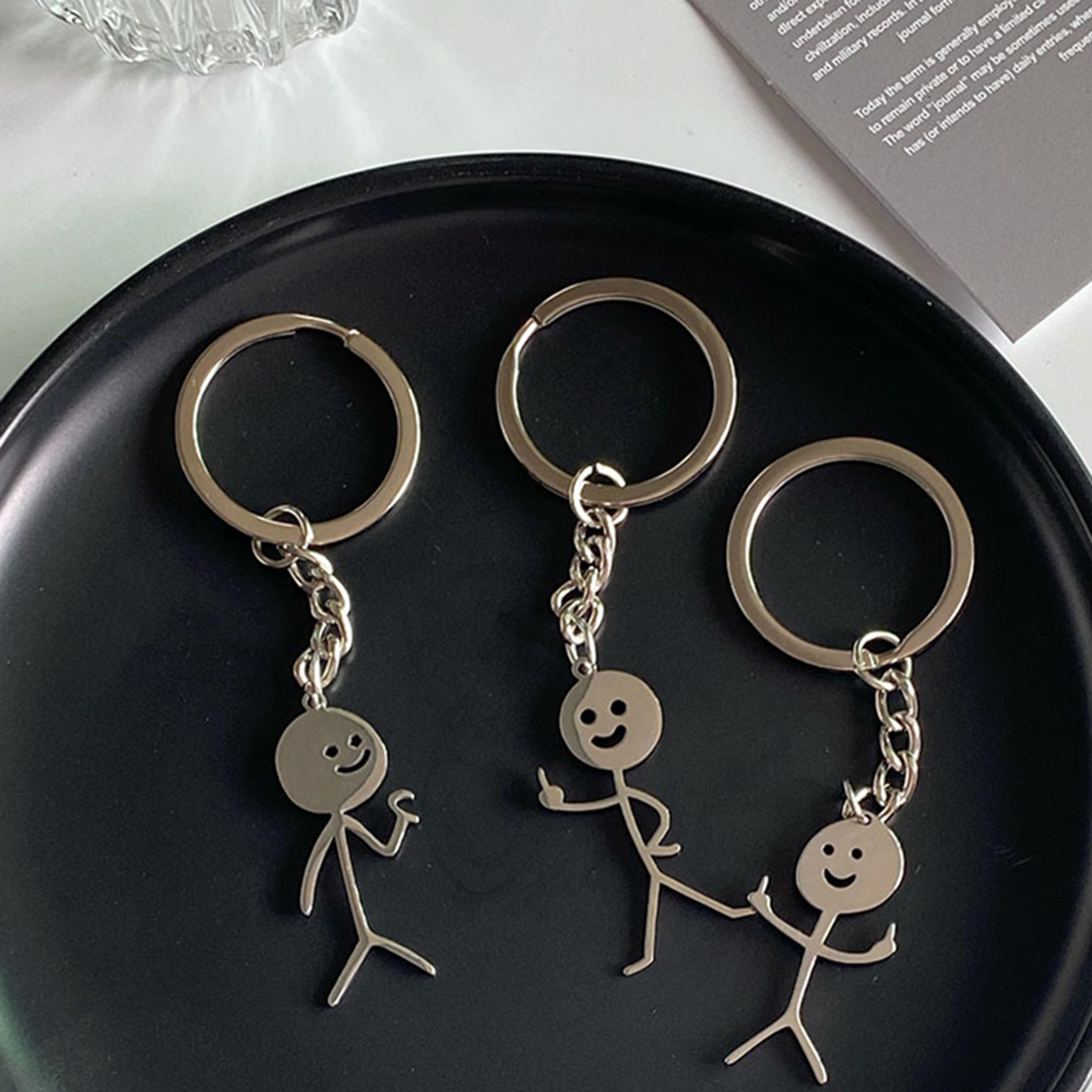quirky heart to heart & middle finger key ring