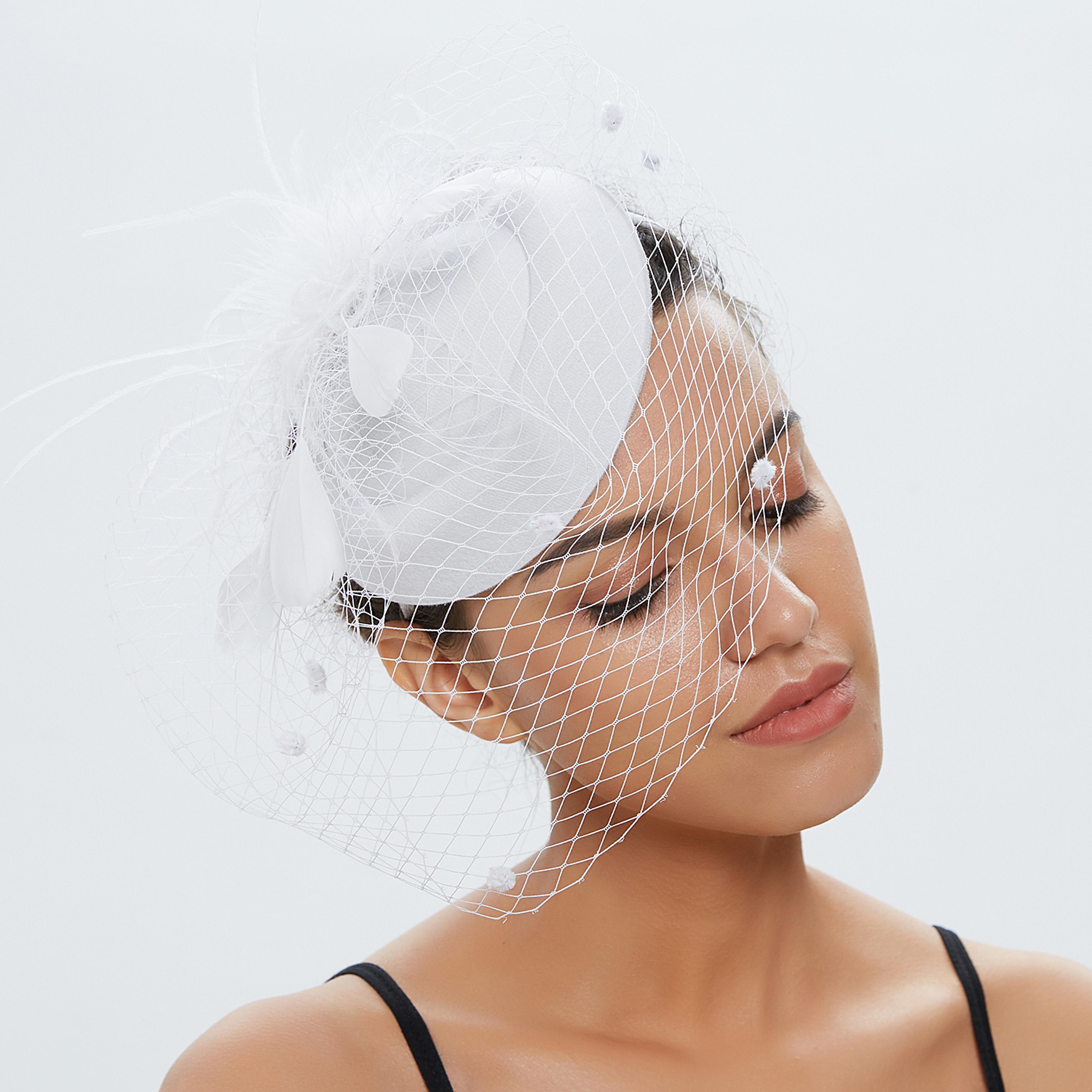 vintage bridal felt fascinator hat with fishnet veil and hair clip for weddings and cocktail parties