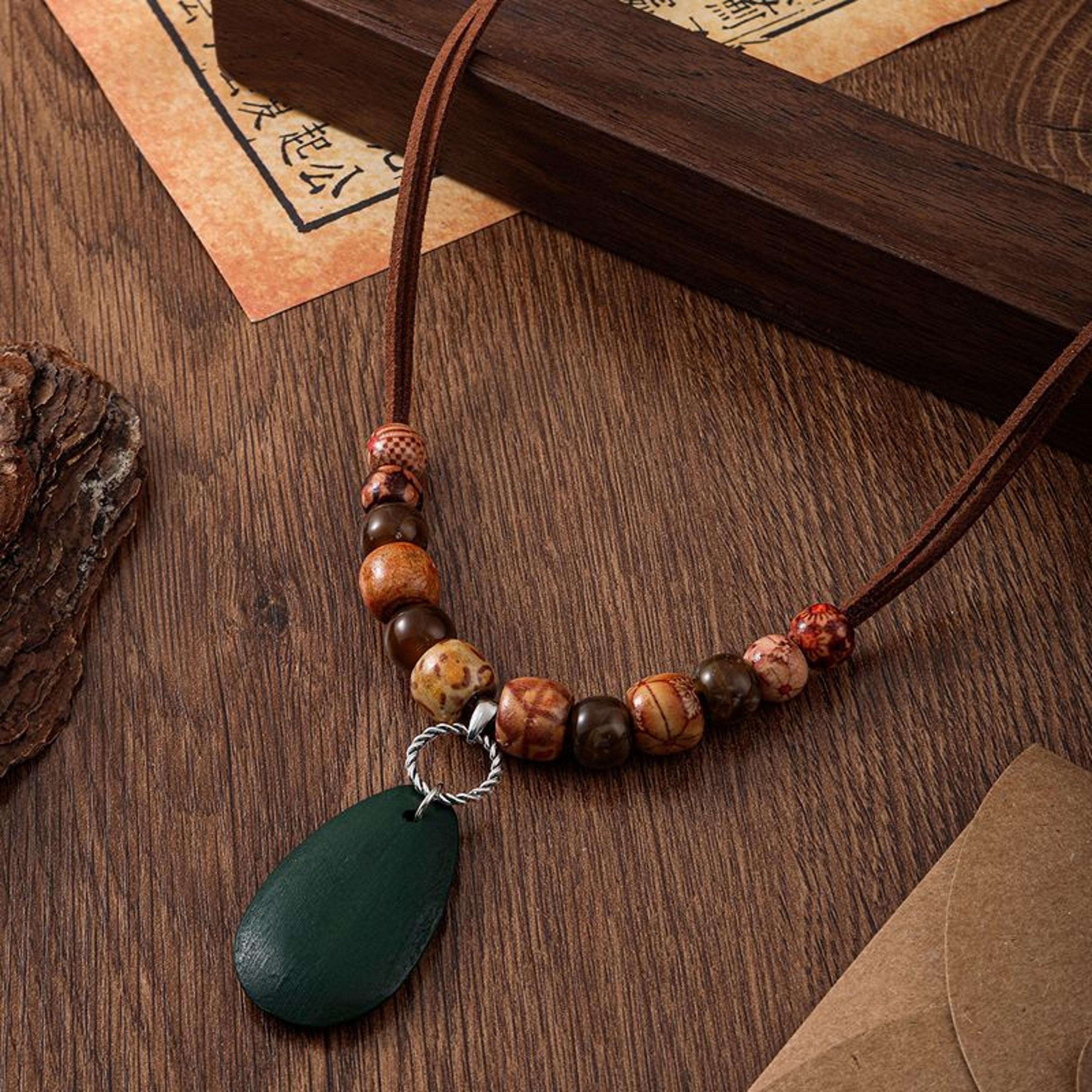 handmade wooden beaded necklace with ethnic totem pendant